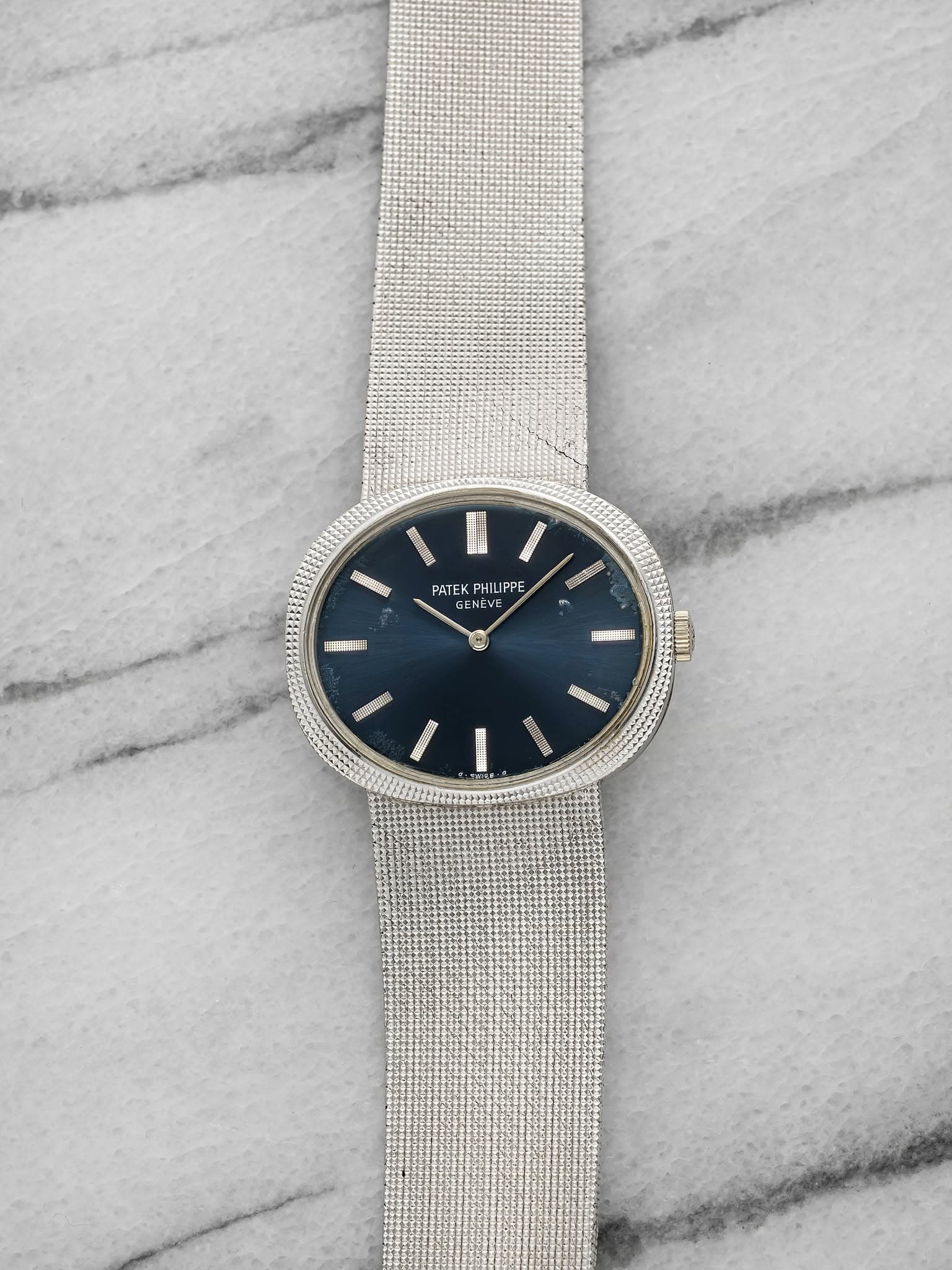 May be an image of wrist watch, jewelry and text