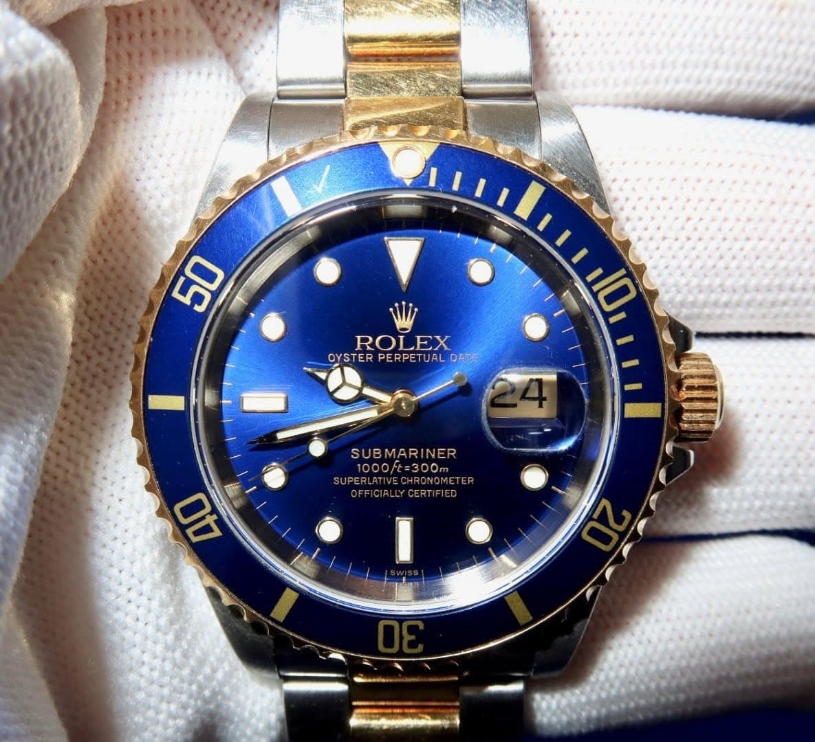 May be an image of wrist watch and text