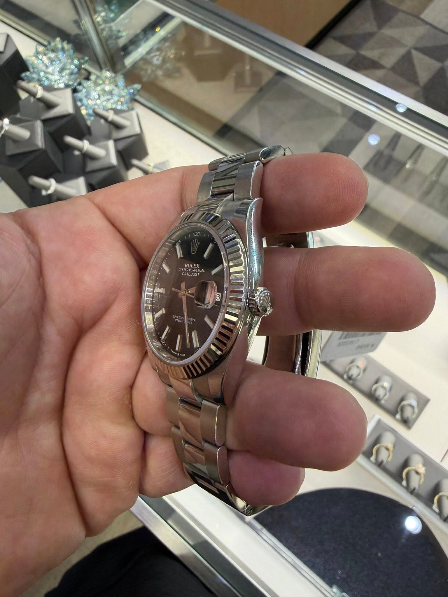 May be an image of wrist watch and text