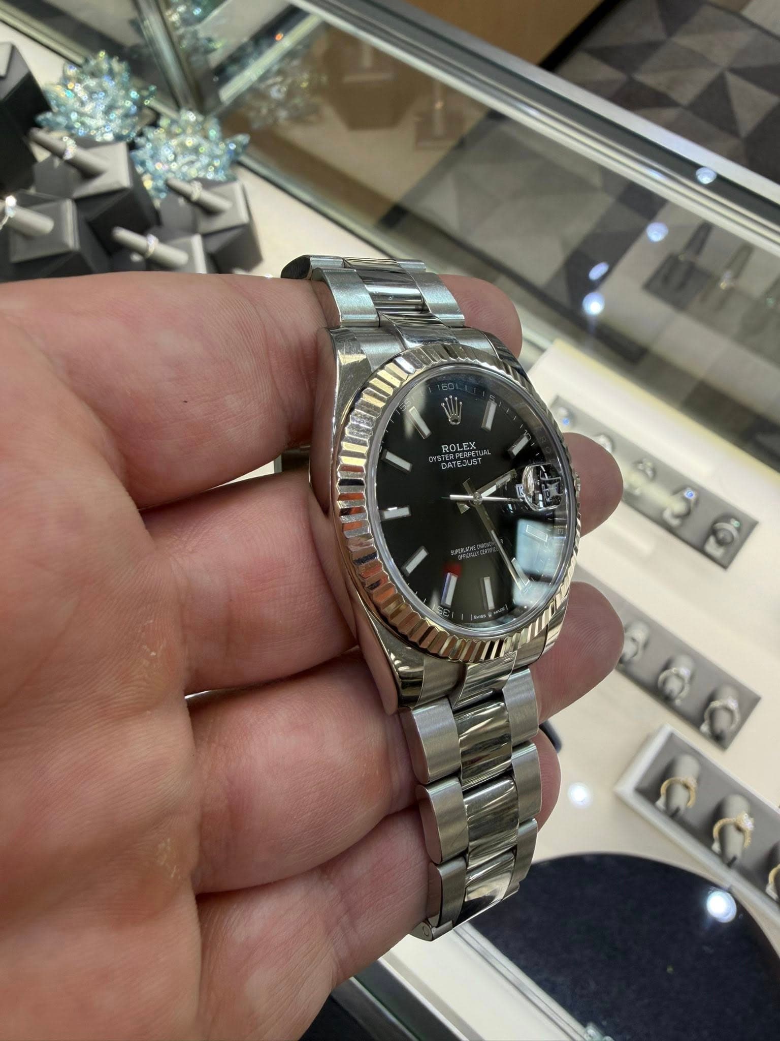 May be an image of wrist watch and text that says 'ROLEX OLEX น ٢۲'