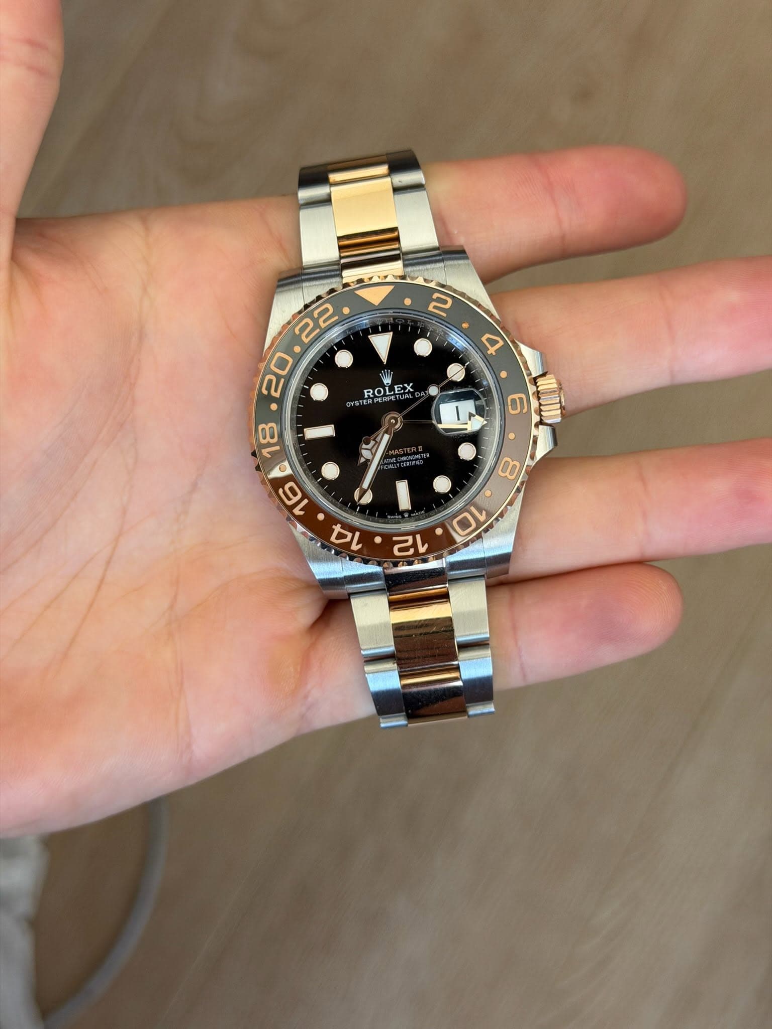 May be an image of wrist watch and text