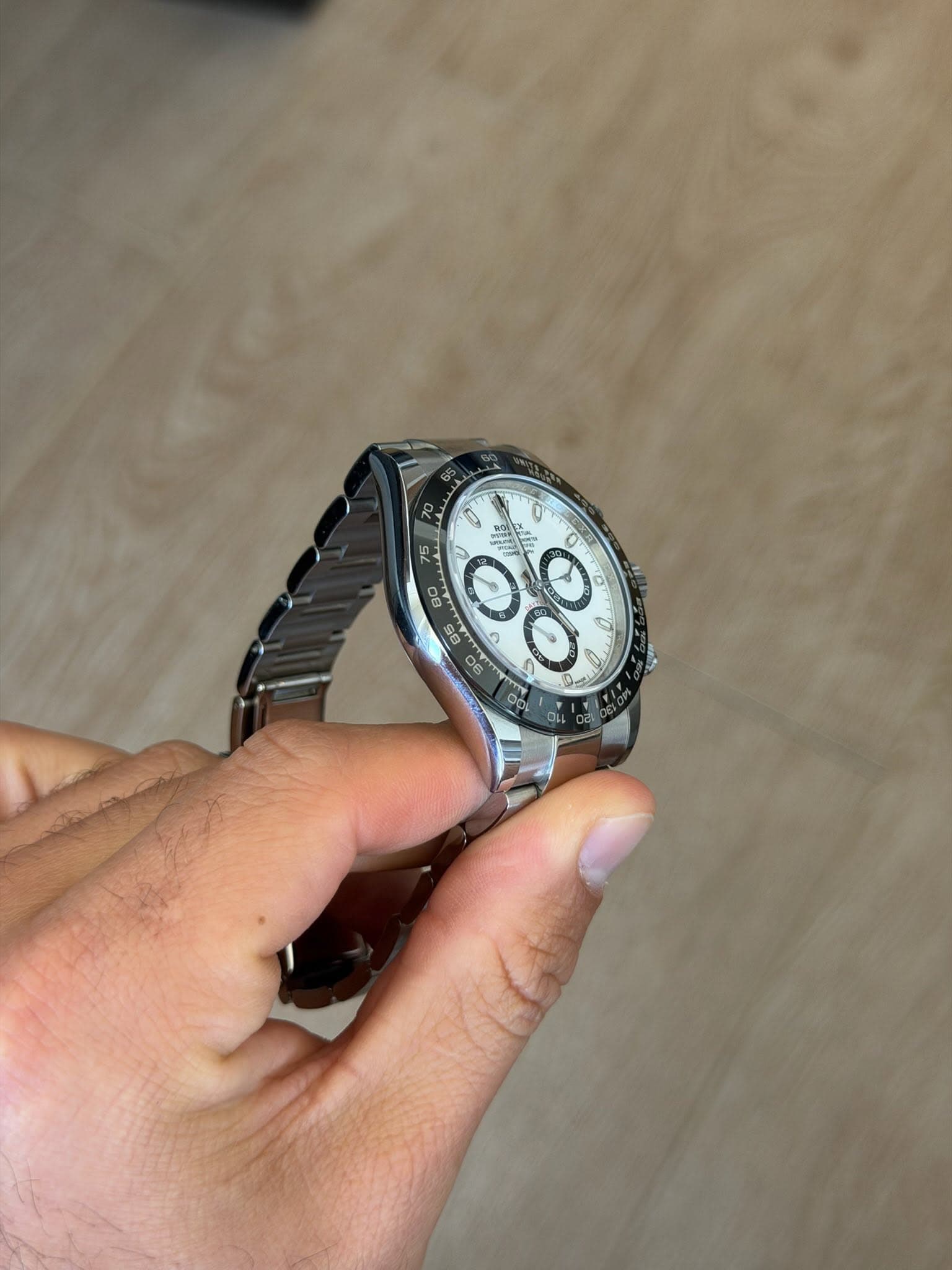 May be an image of wrist watch and text