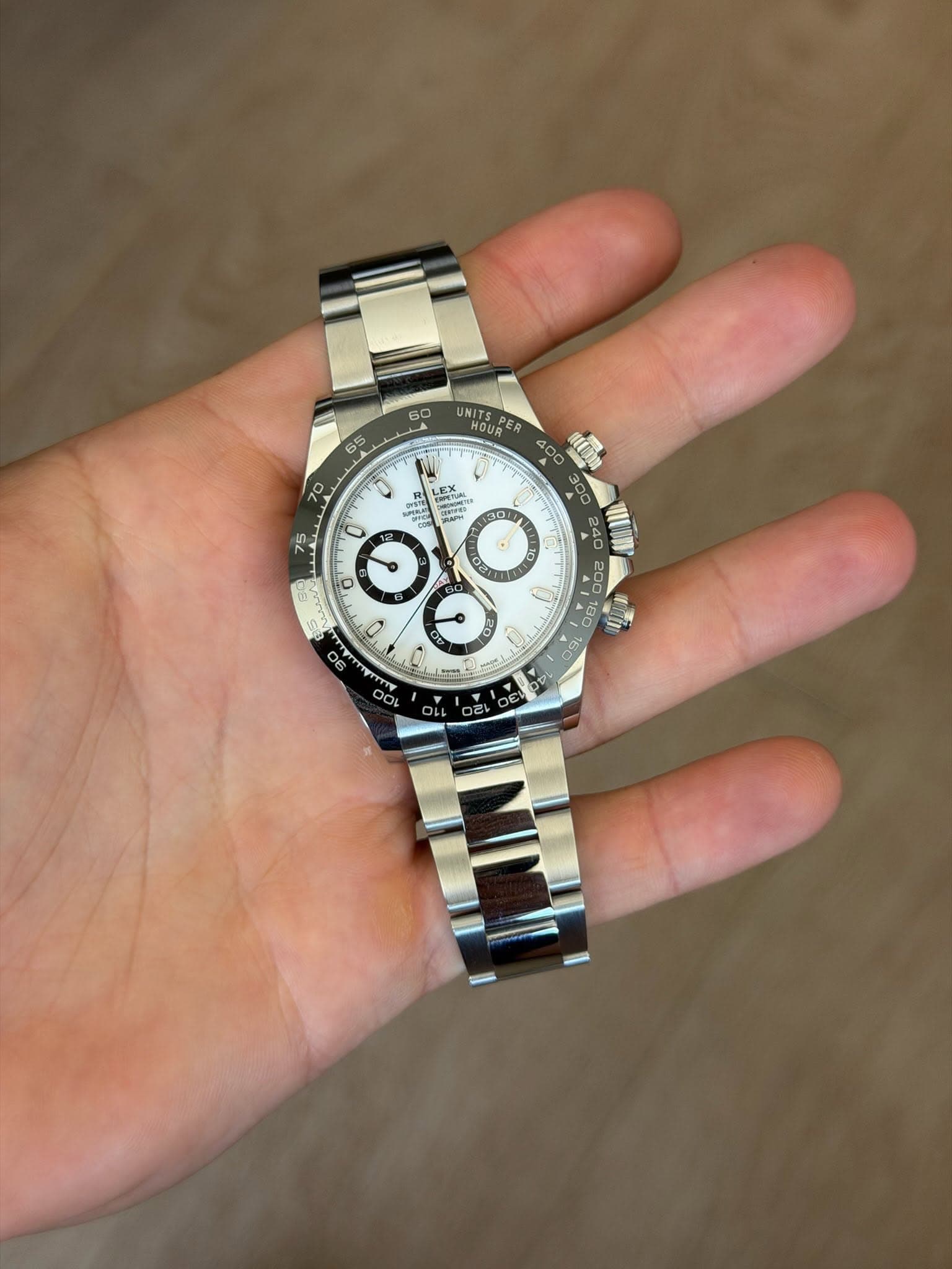 May be an image of wrist watch and text