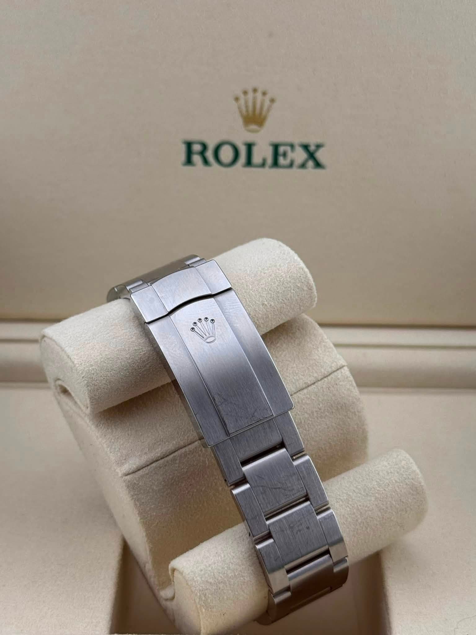 May be an image of wrist watch and text that says 'ROLEX'