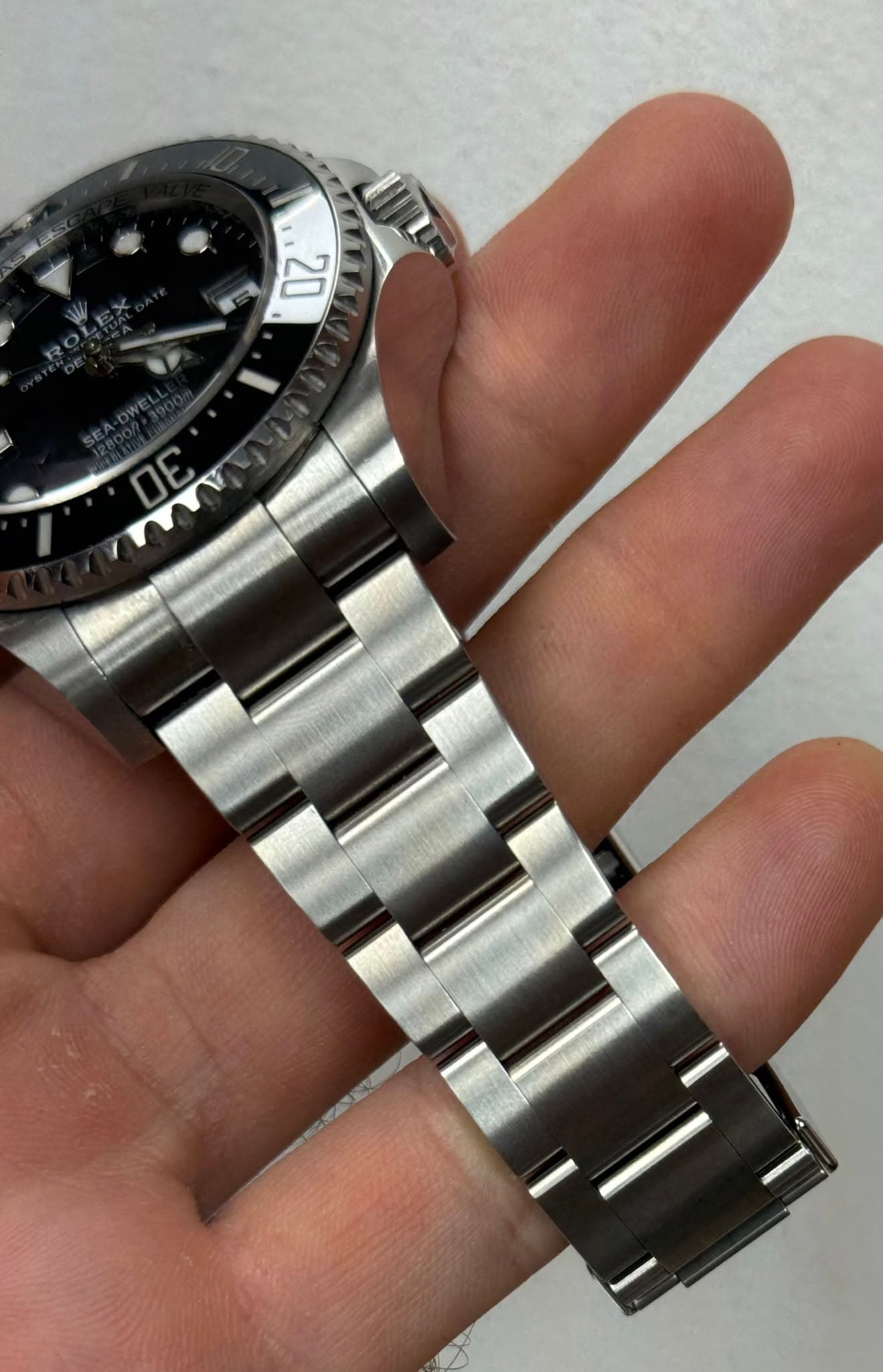 May be an image of wrist watch and text