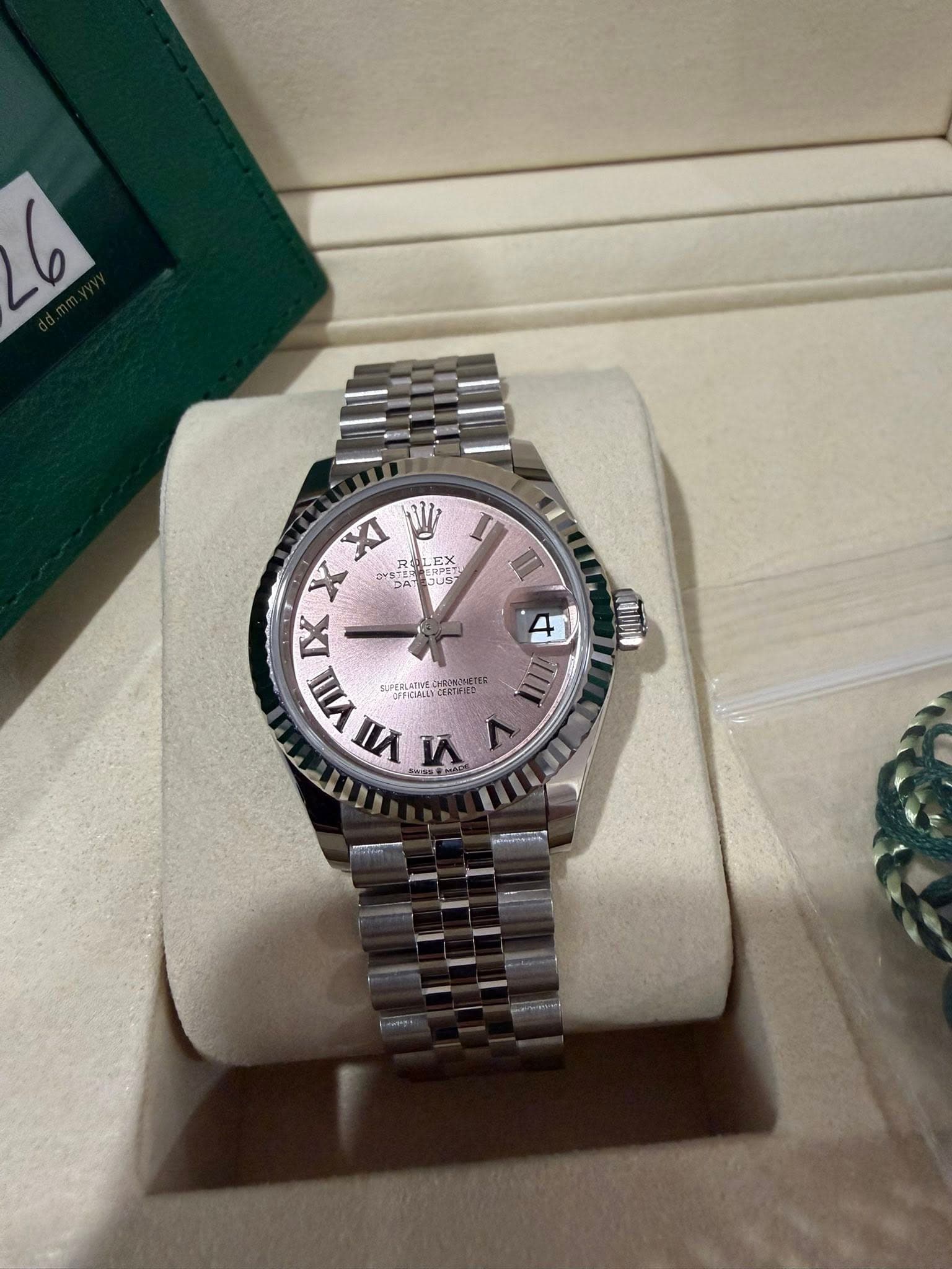 May be an image of wrist watch and text
