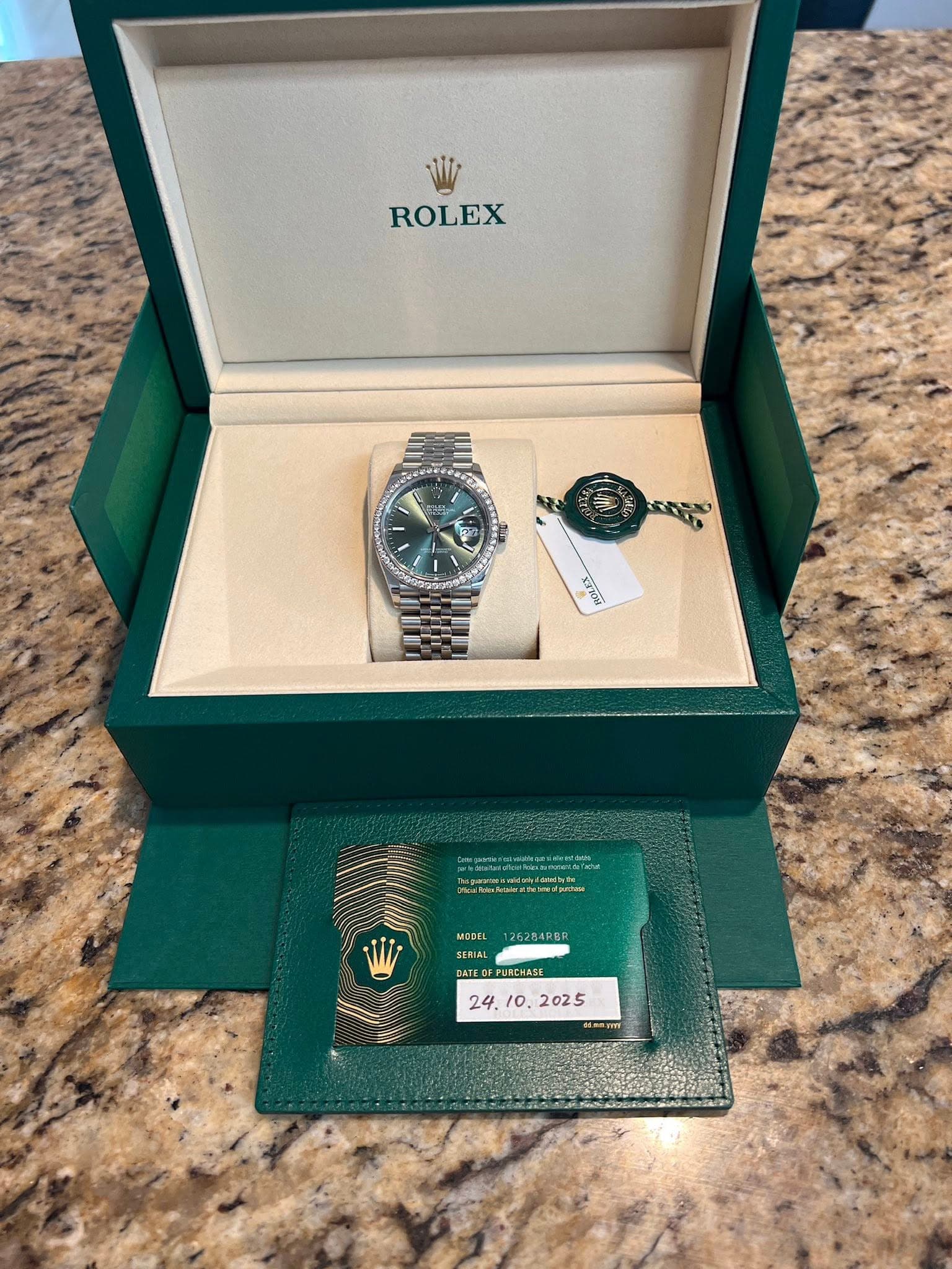 May be an image of wrist watch and text