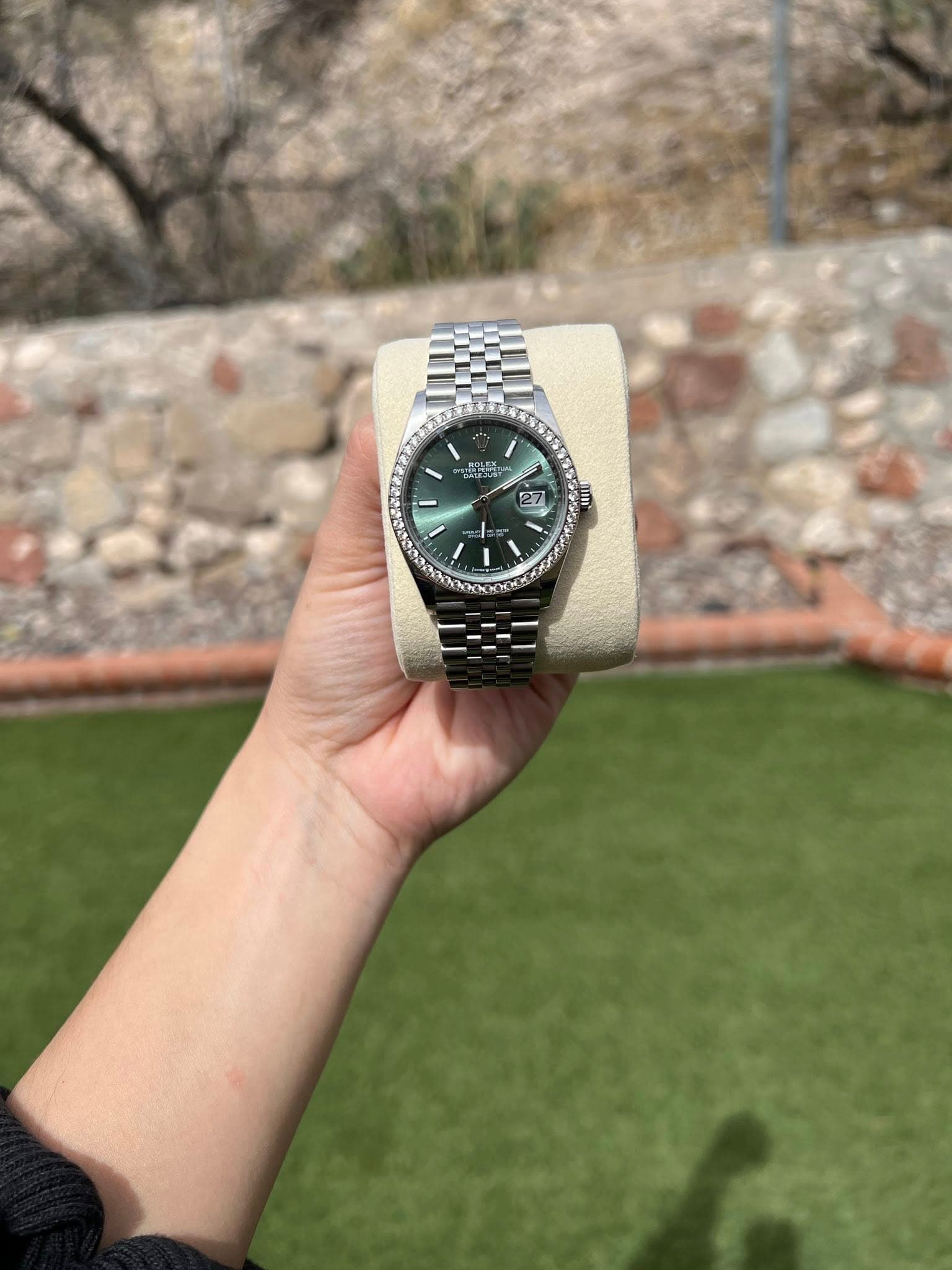 May be an image of wrist watch and text