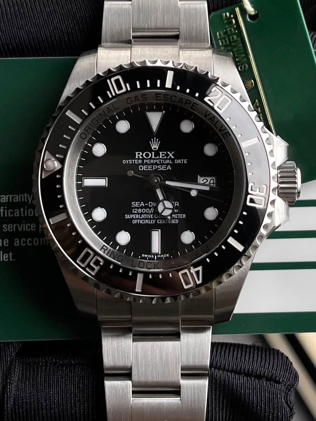 May be an image of wrist watch and text that says '10 20 ROLEX OYSTER PERPETUAL DATE DEEPSEA 24 R SEA-D 12800f SUPERLATIVE OFFICIALLY METER IED 30 w 50 RI اله SwIss ADE 0U'