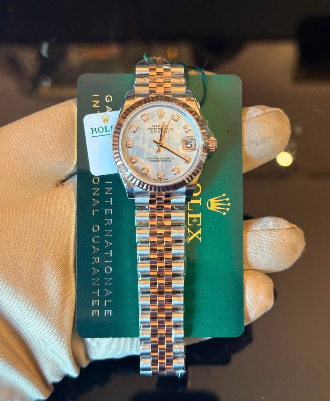 May be an image of wrist watch and text