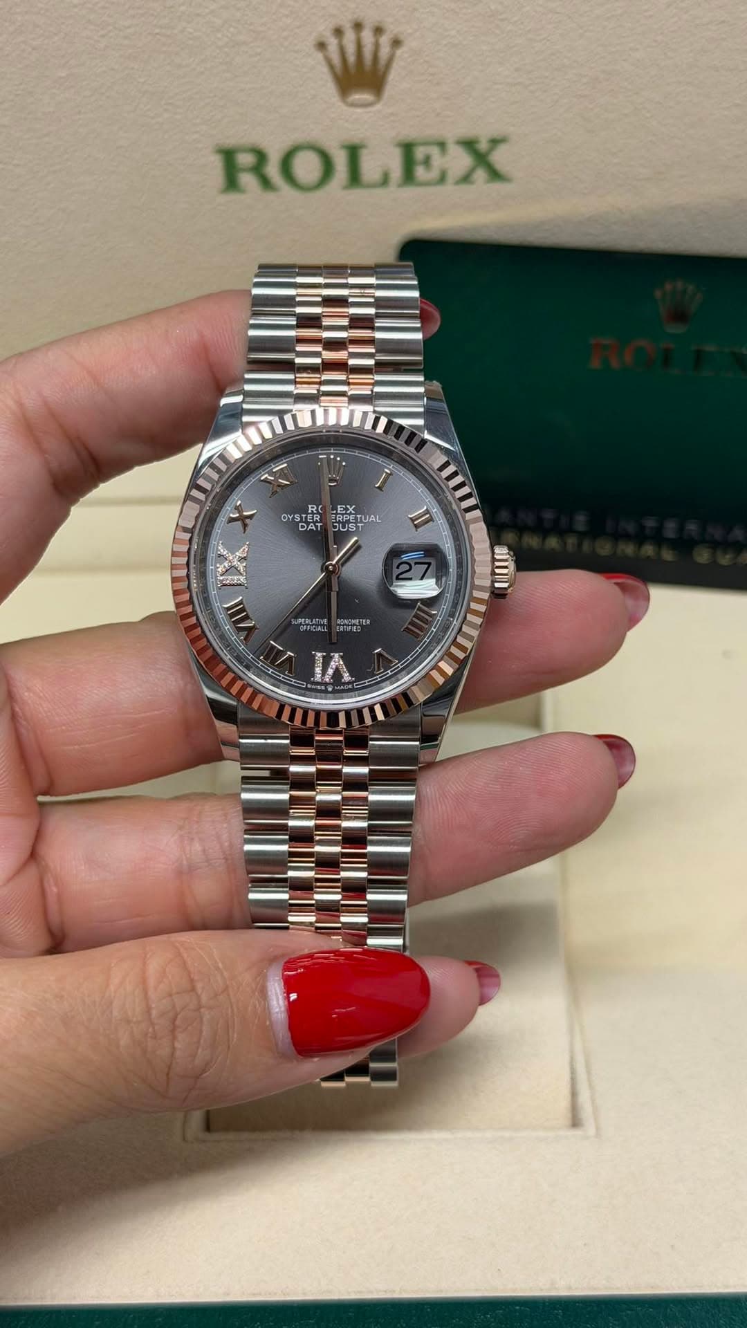 May be an image of wrist watch and text