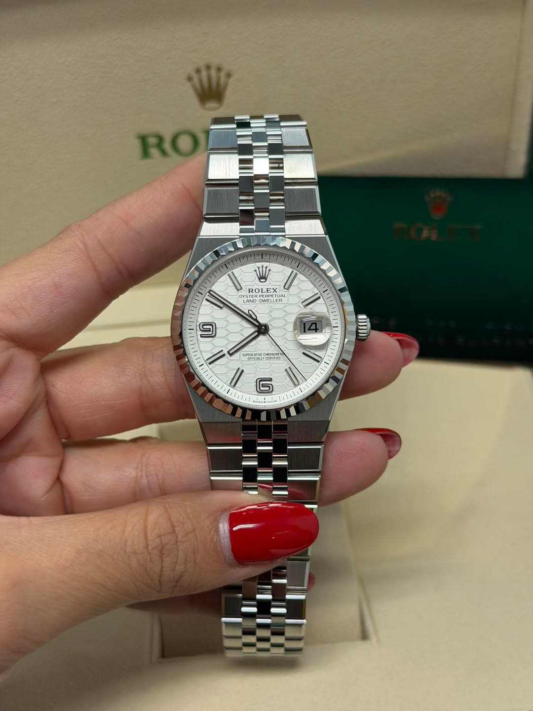 May be an image of wrist watch and text
