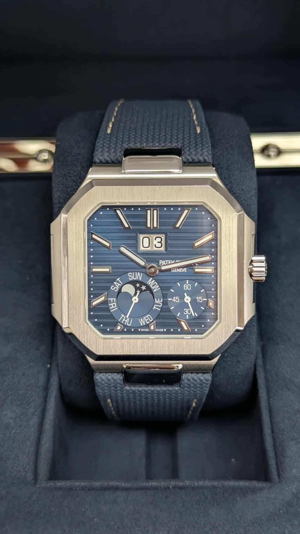 May be an image of digital watch and text that says '03 PATEV GENEVE a SUN MON SAT 비- 벌 ገህ WED a GIDE'