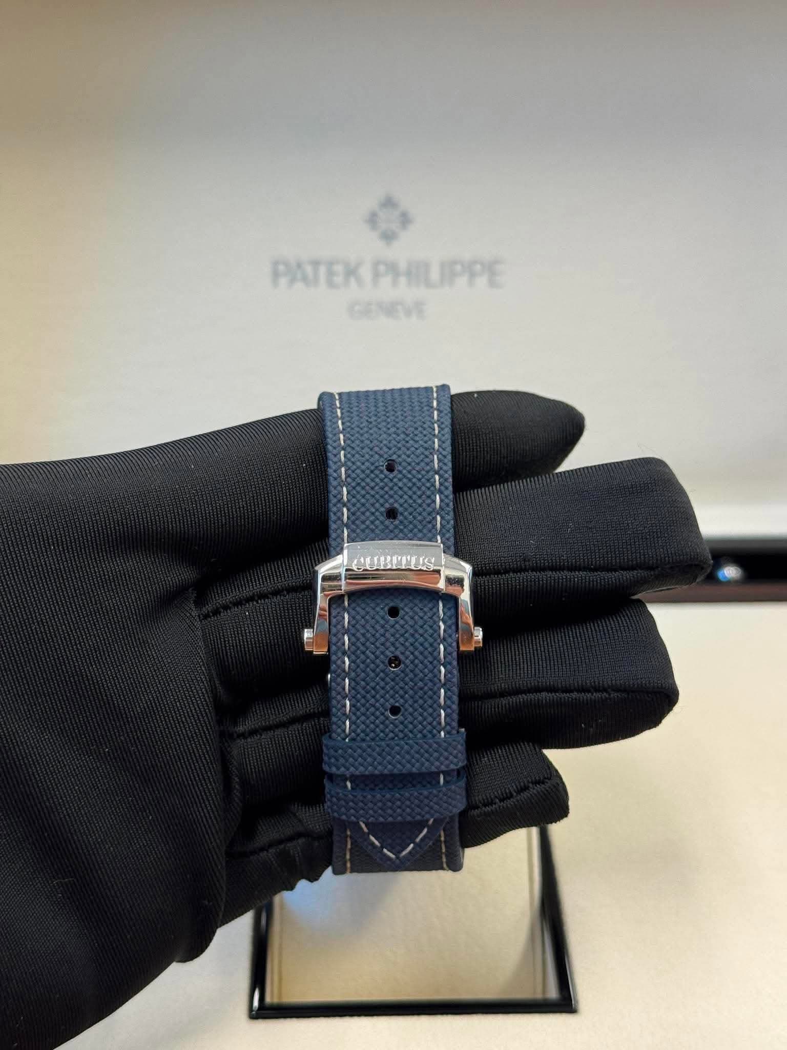 May be an image of wrist watch and text that says 'PATEK ATEKPHILIPPE GENEVE'