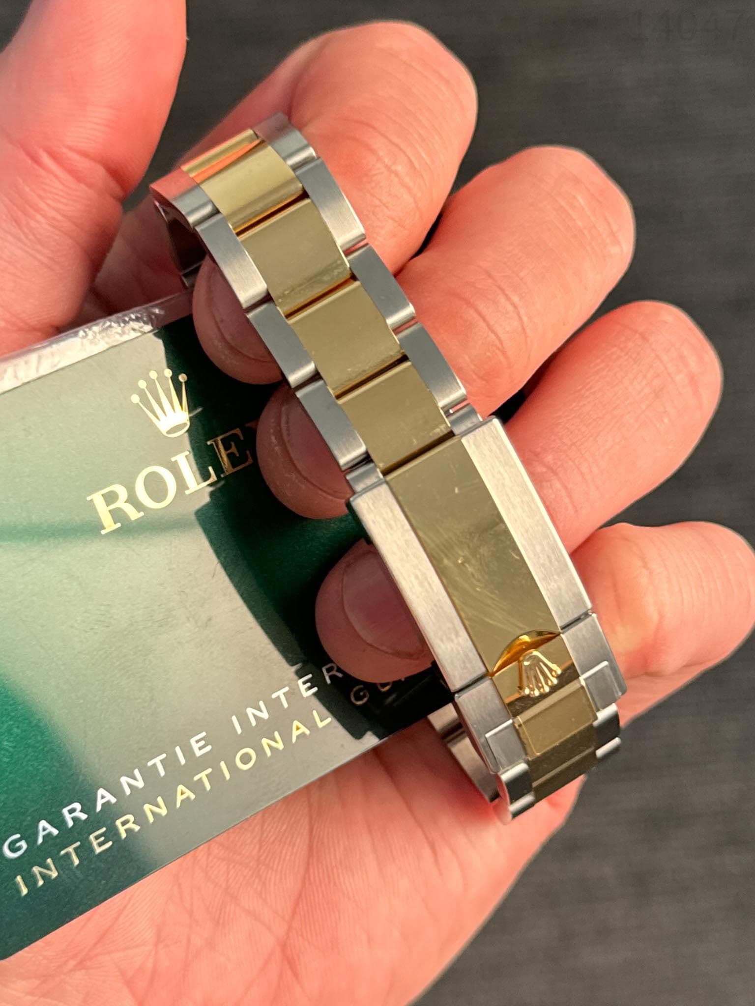 May be an image of wrist watch and text