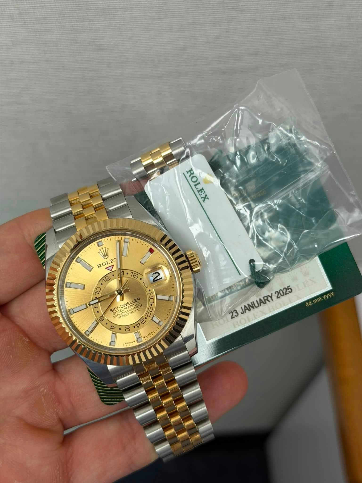 May be an image of wrist watch and text