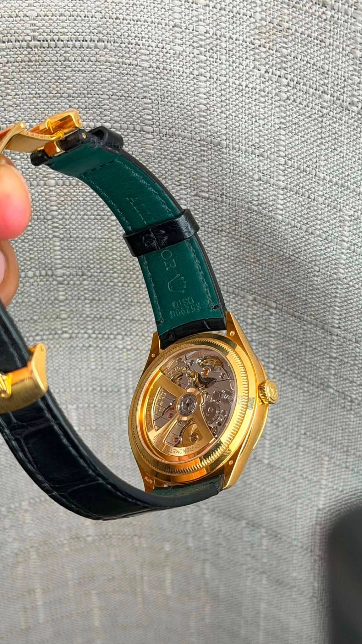 May be an image of wrist watch and text