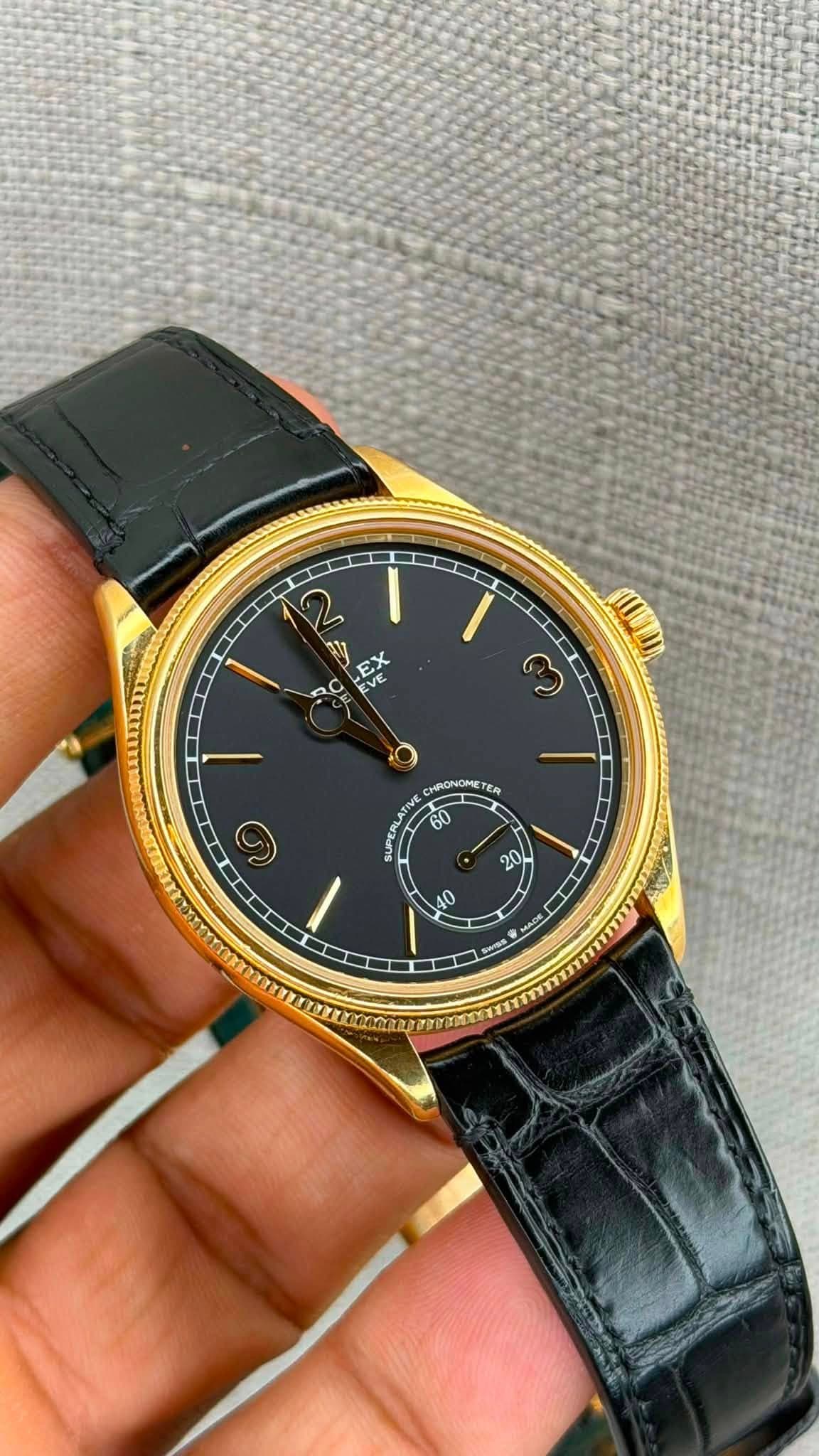 May be an image of wrist watch and text