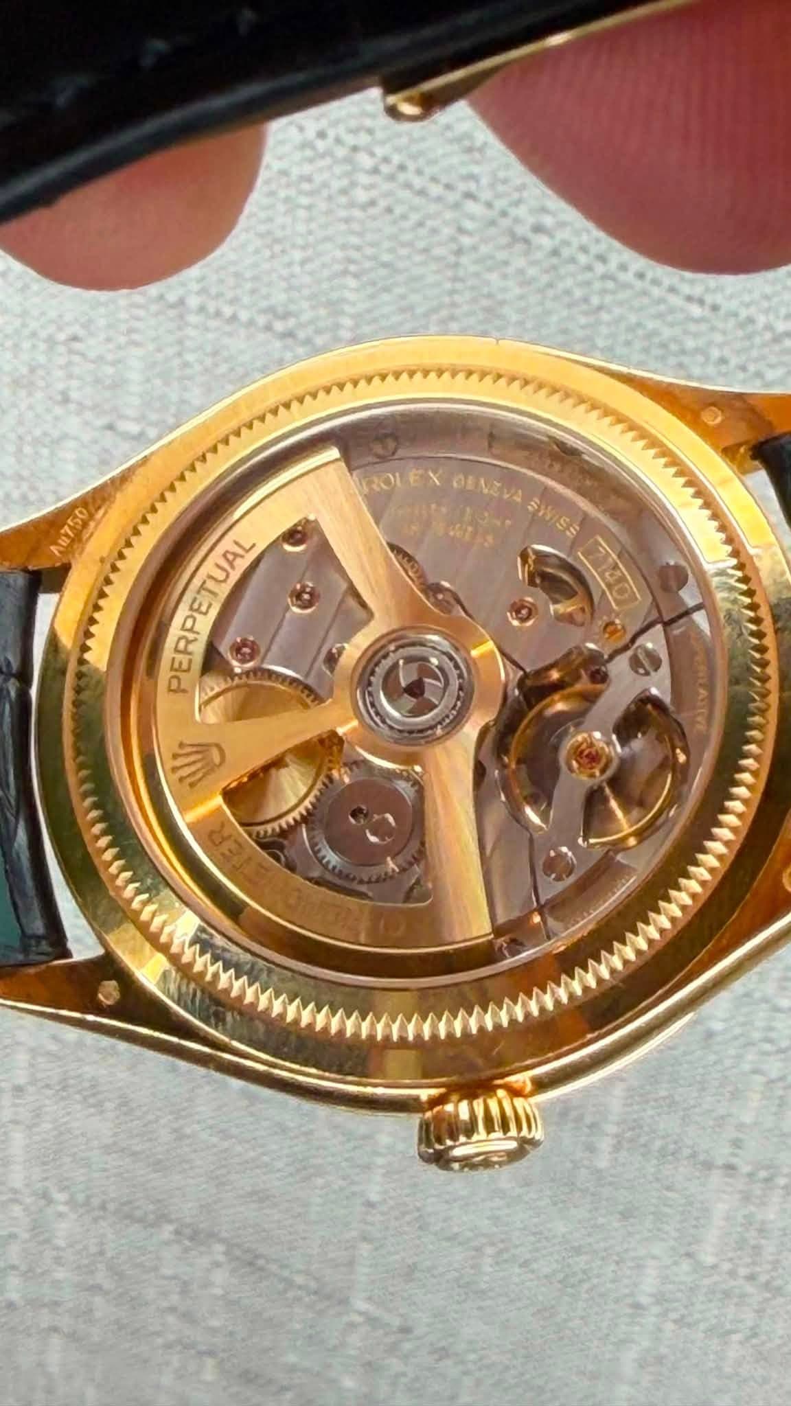 May be an image of wrist watch and text