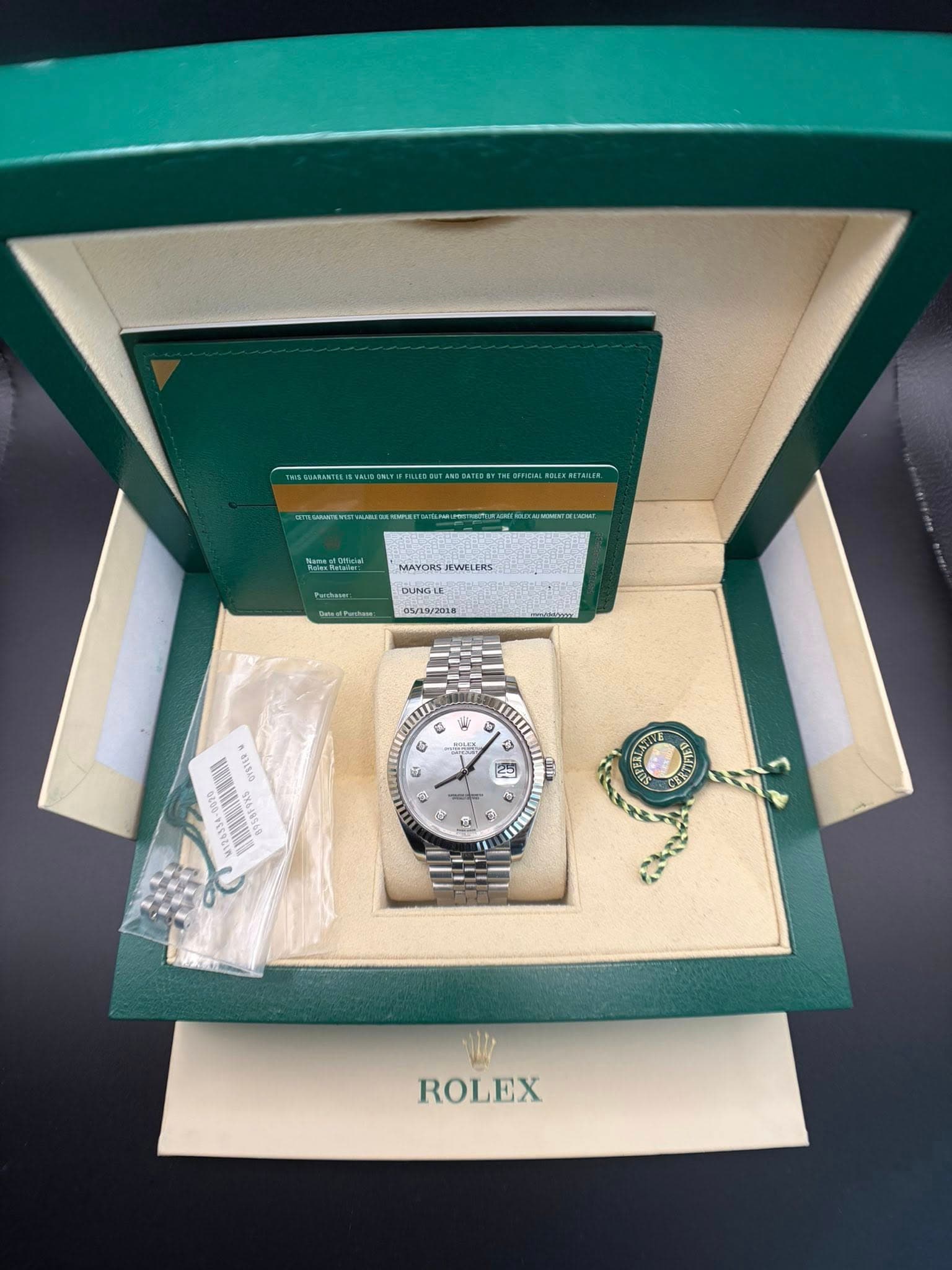 May be an image of wrist watch and text