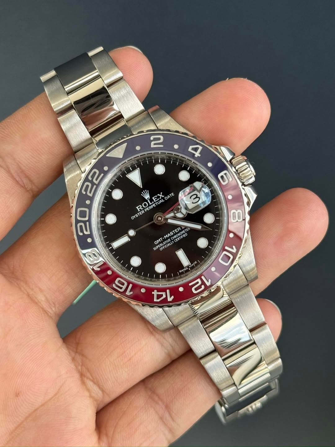 May be an image of wrist watch and text