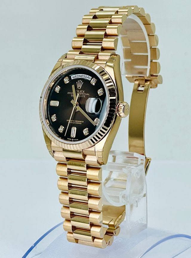 May be an image of jewelry, digital watch and text