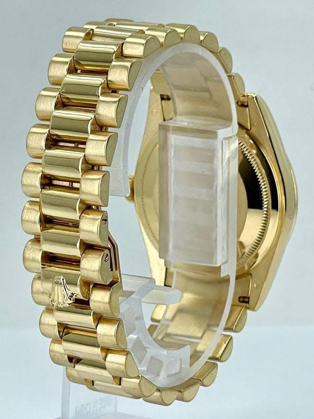 May be an image of jewelry, digital watch and text