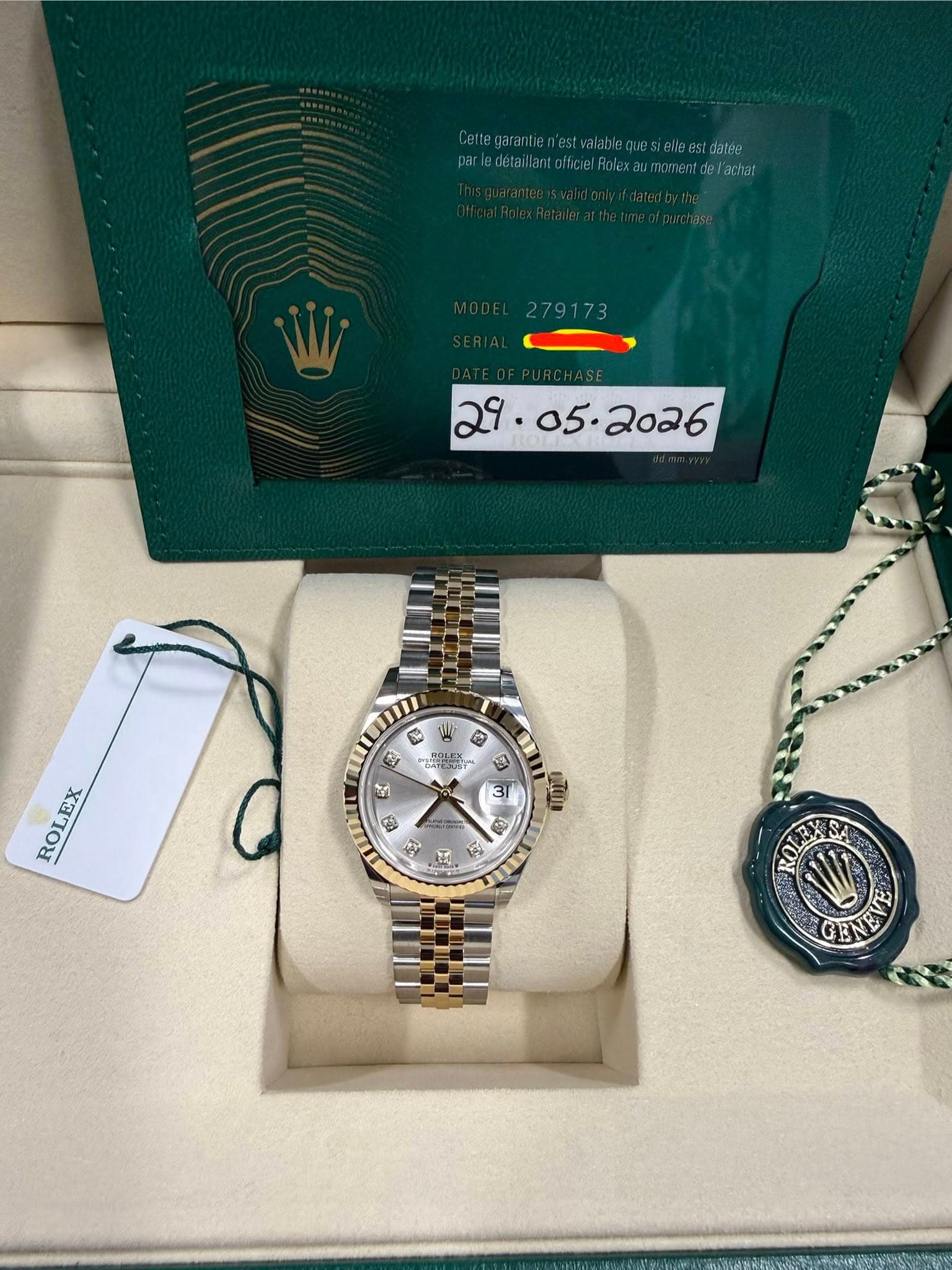 May be an image of wrist watch and text