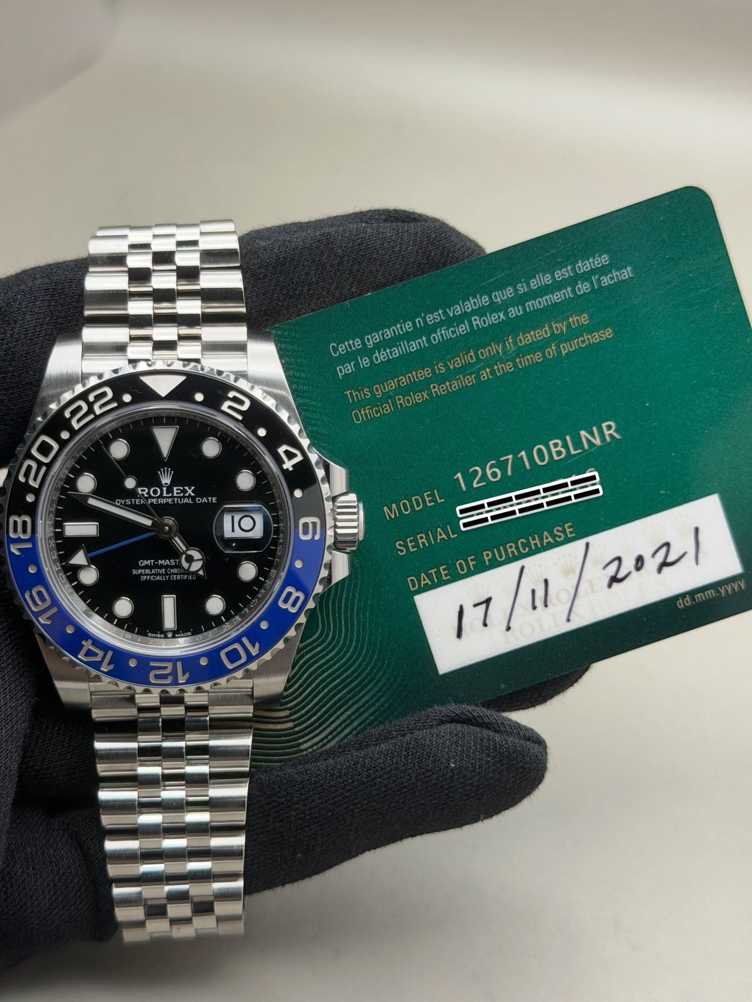 May be an image of wrist watch and text that says '2 4 st datee l'achat va officiel Rolex fhsguaranteesveo.medeu dated lable que stelle moment de Cette poriecetaattto garantie es…