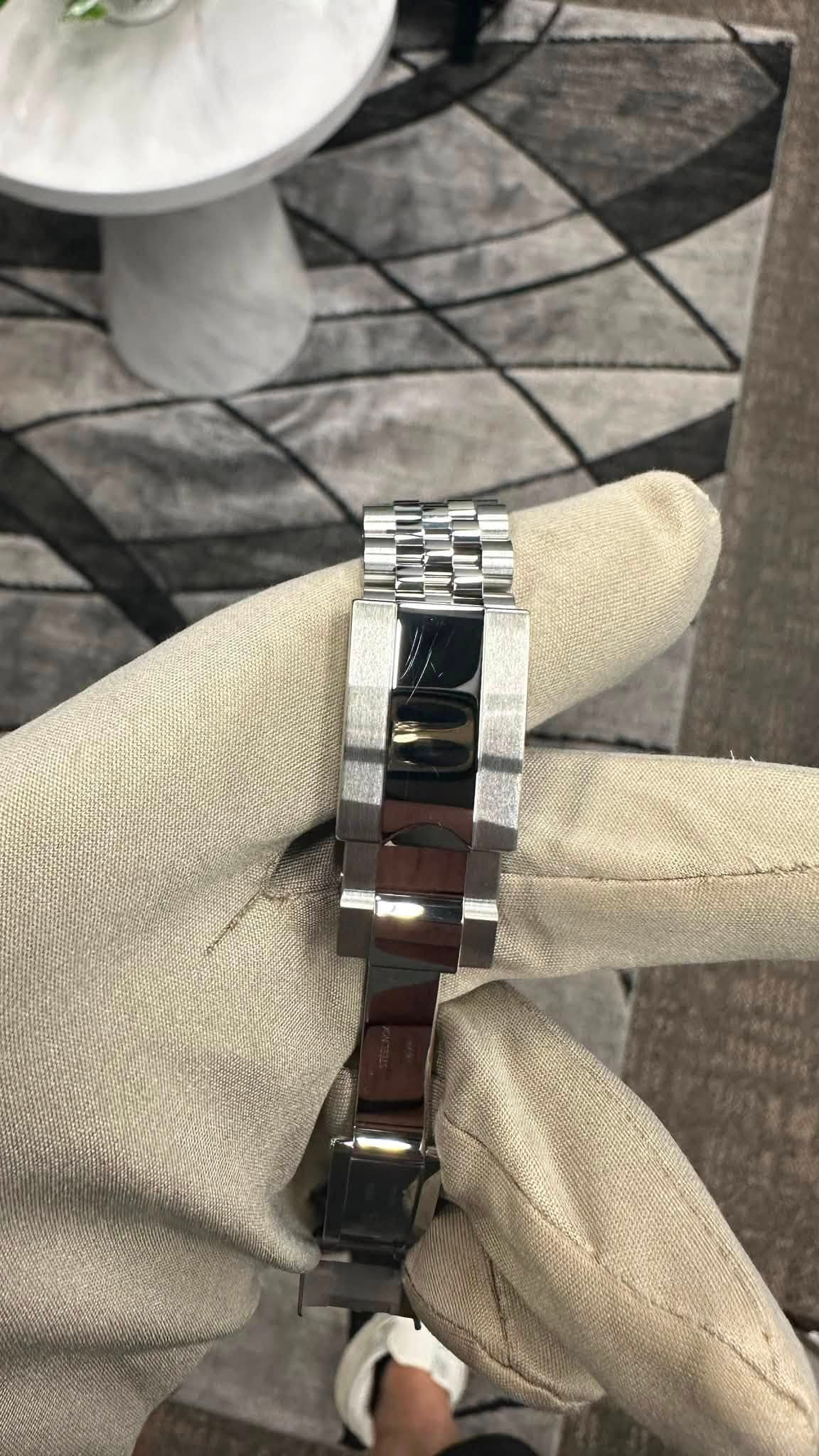 May be an image of wrist watch