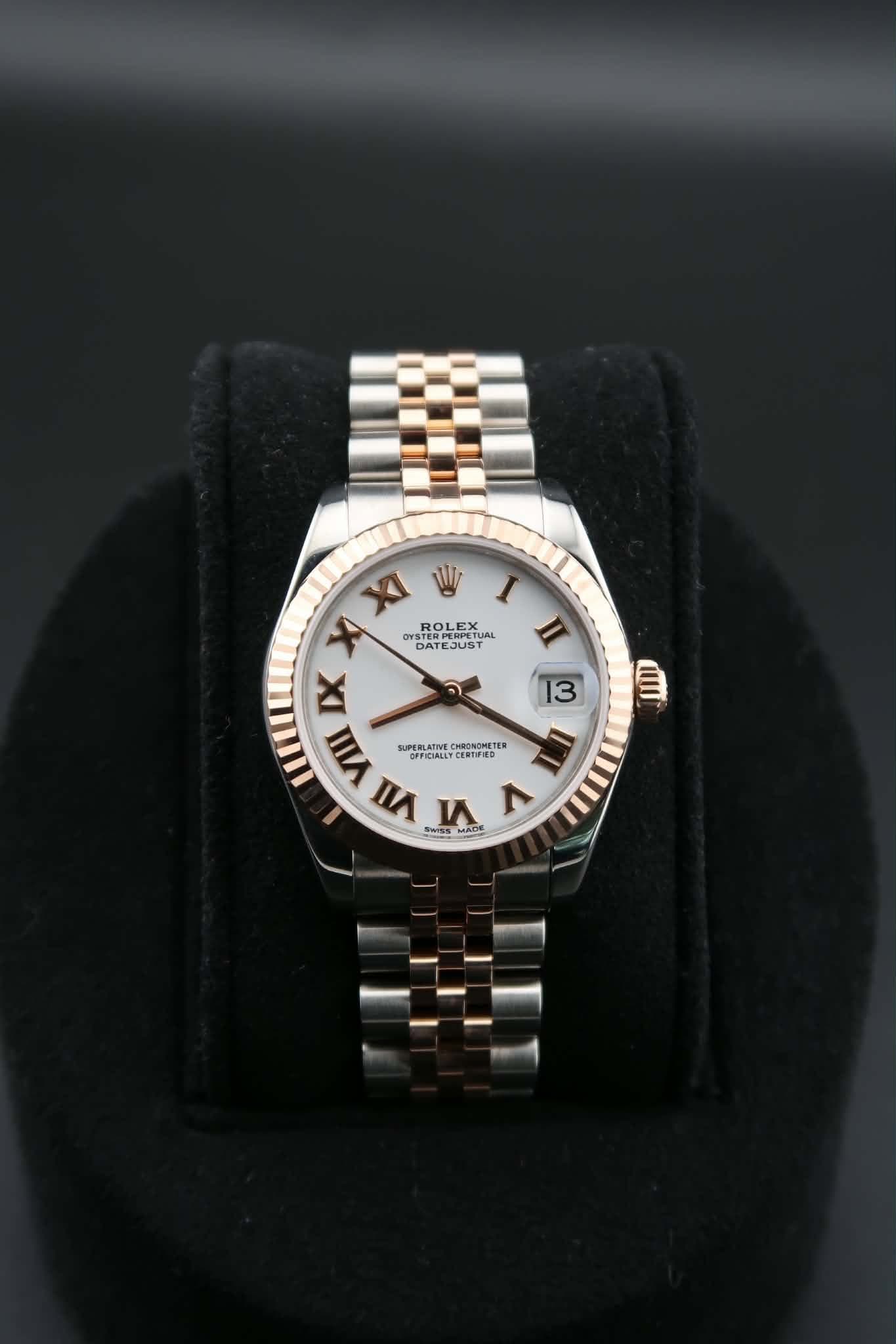May be an image of wrist watch, jewelry and text
