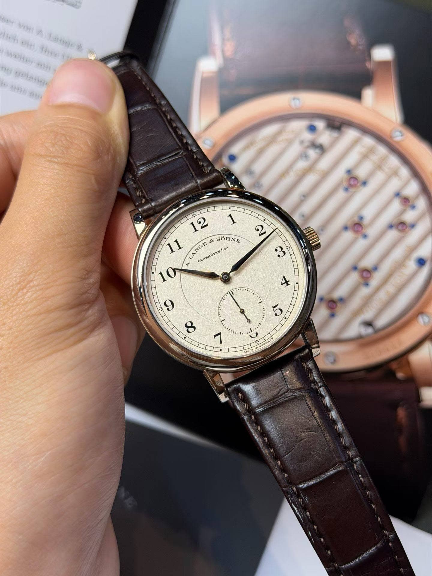 May be an image of wrist watch and text