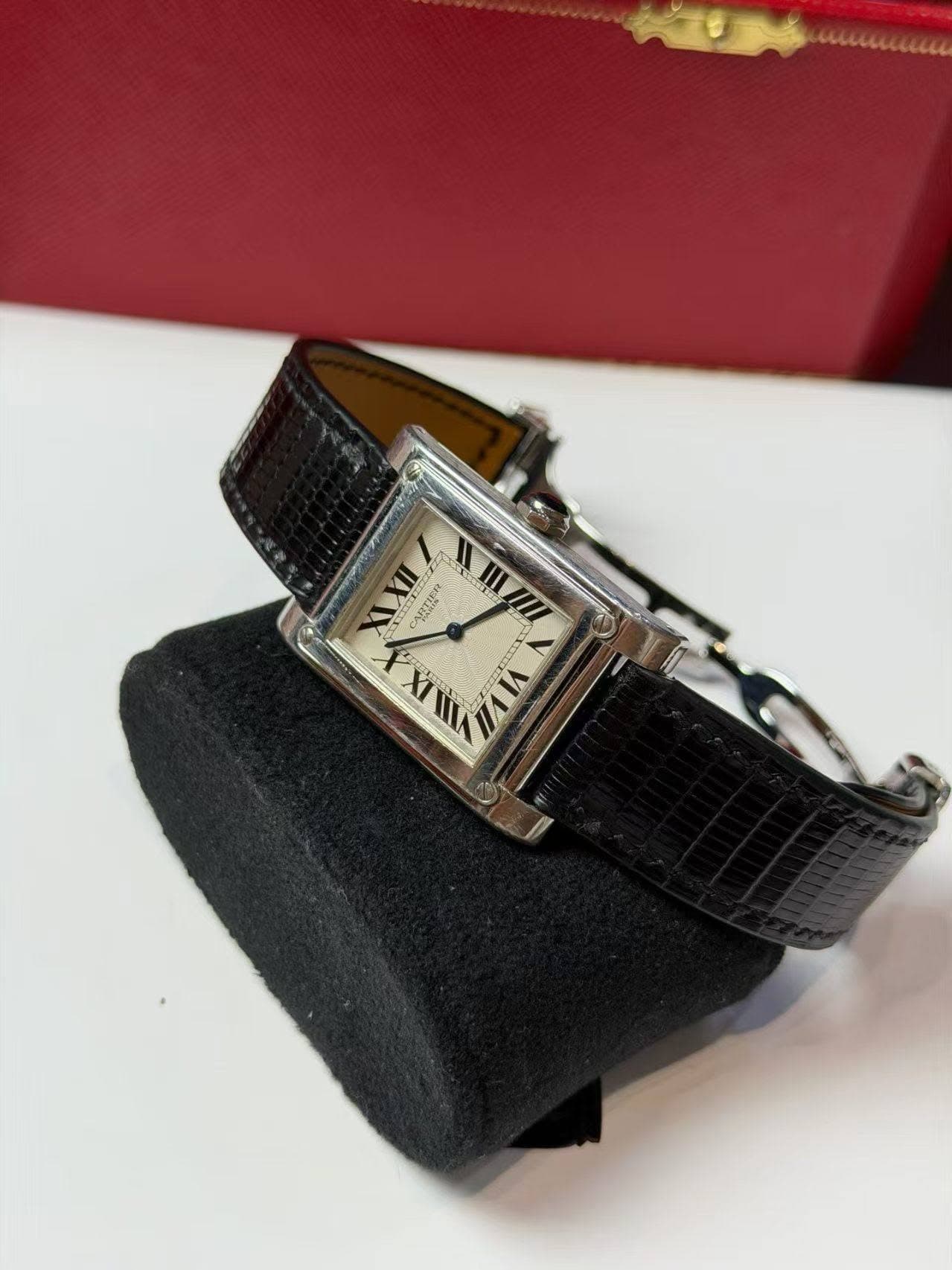 May be an image of wrist watch and text