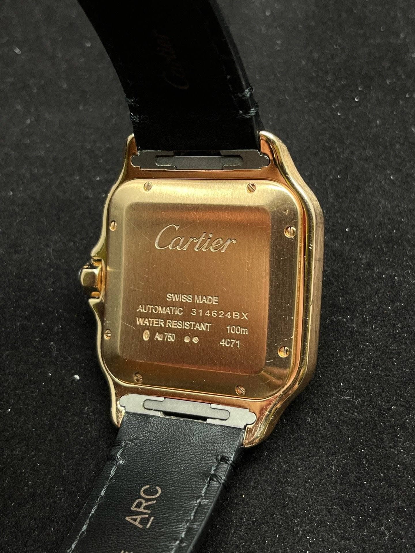 May be an image of digital watch and text that says 'Cartier SWISS MADE AUTOMATIC STOMATIC314624BX 314624BX WATER WATERRESISTANT RESISTANT ® 750 100m ® 4071'