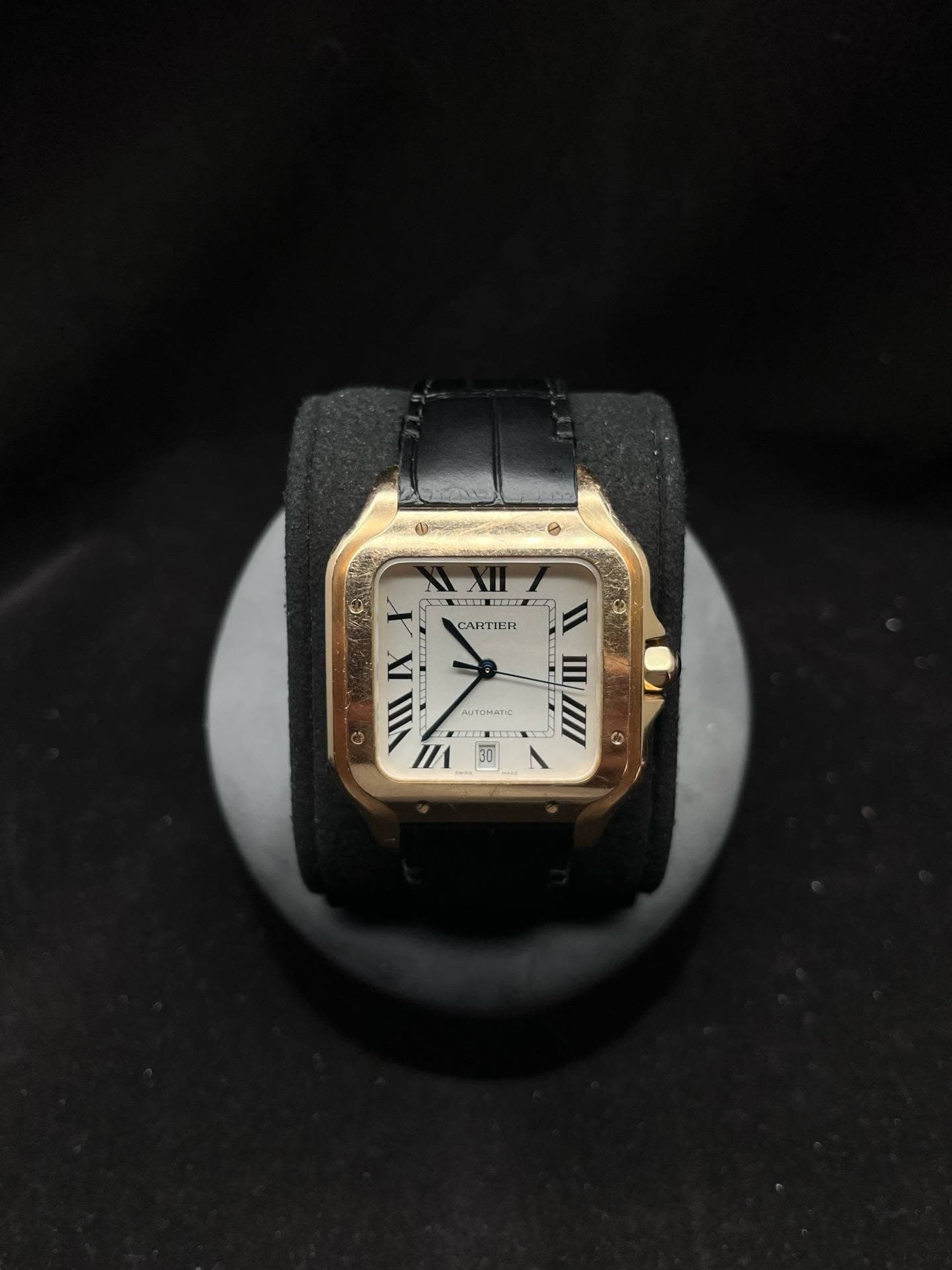 May be an image of digital watch, leather and text