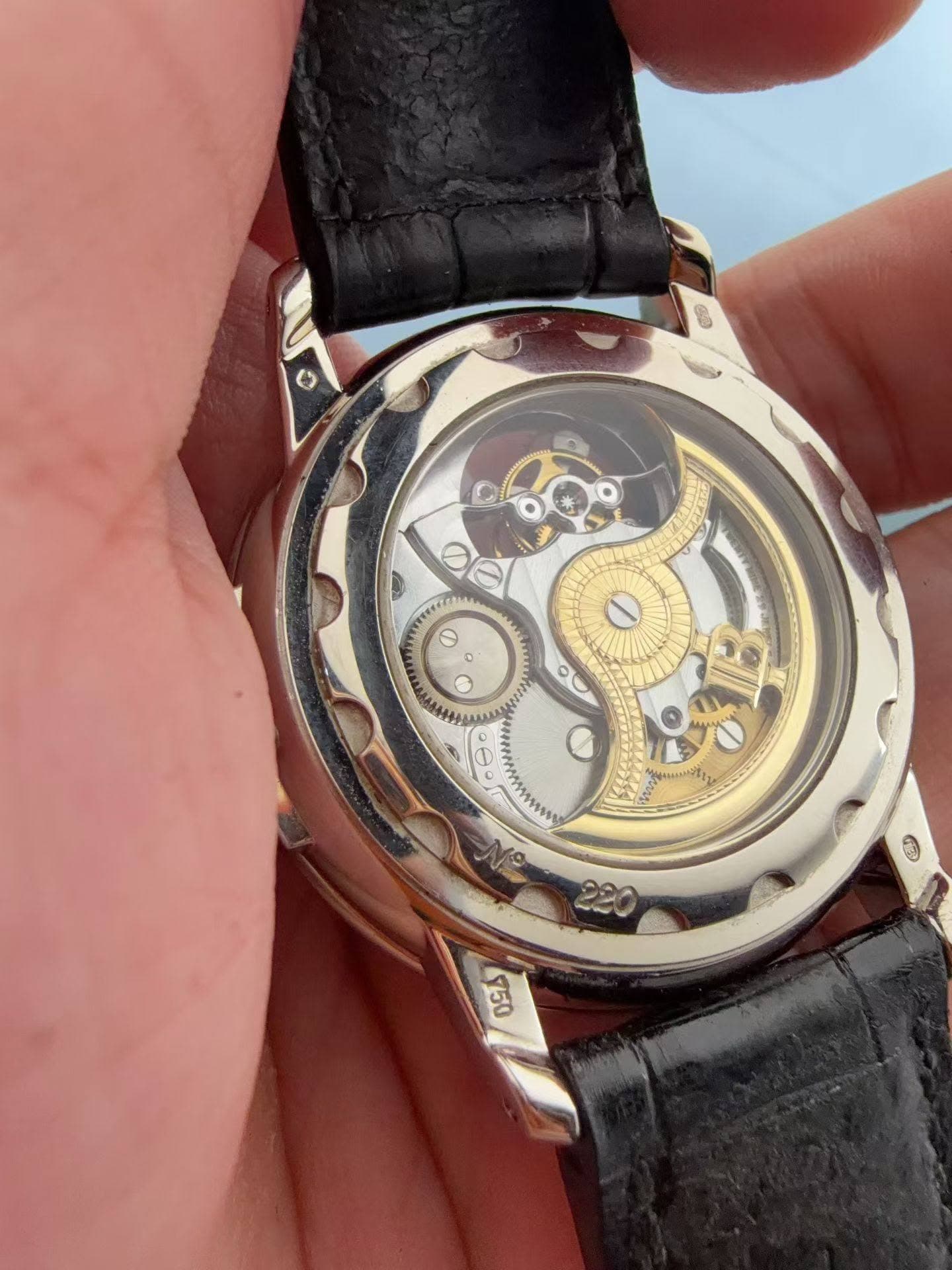 May be an image of wrist watch and text