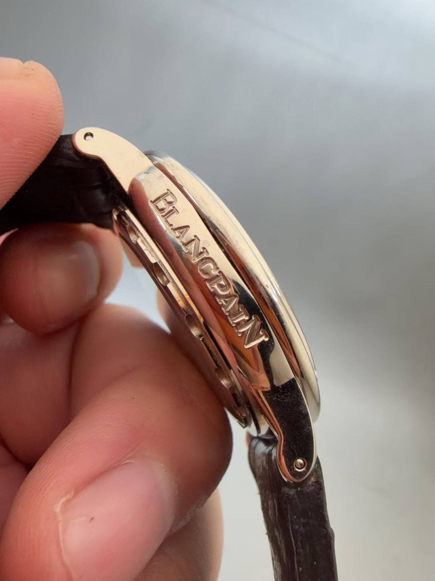 May be an image of wrist watch and text