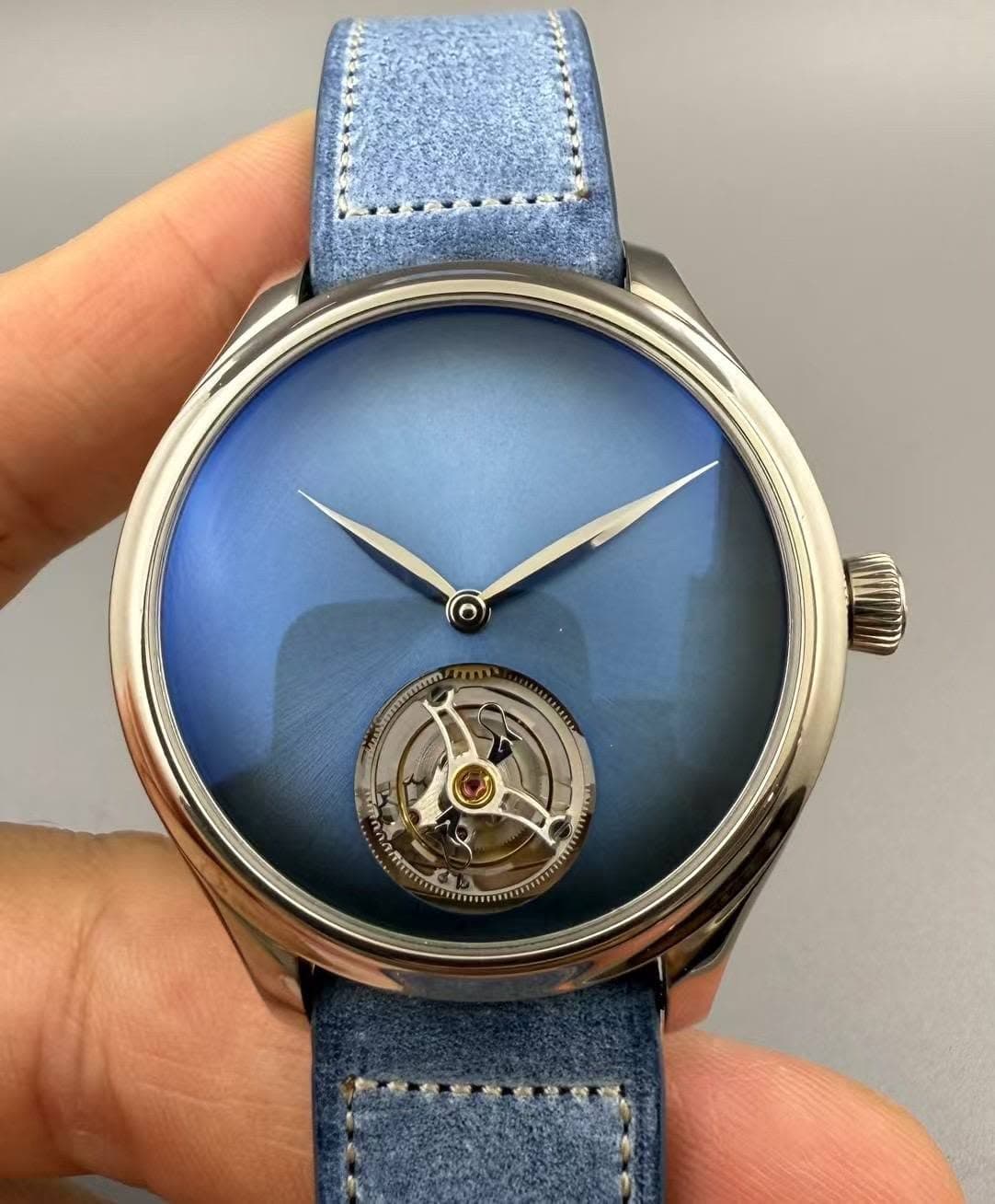 May be an image of wrist watch and text