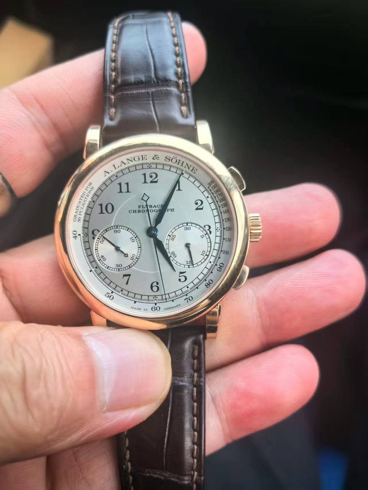 May be an image of wrist watch and text