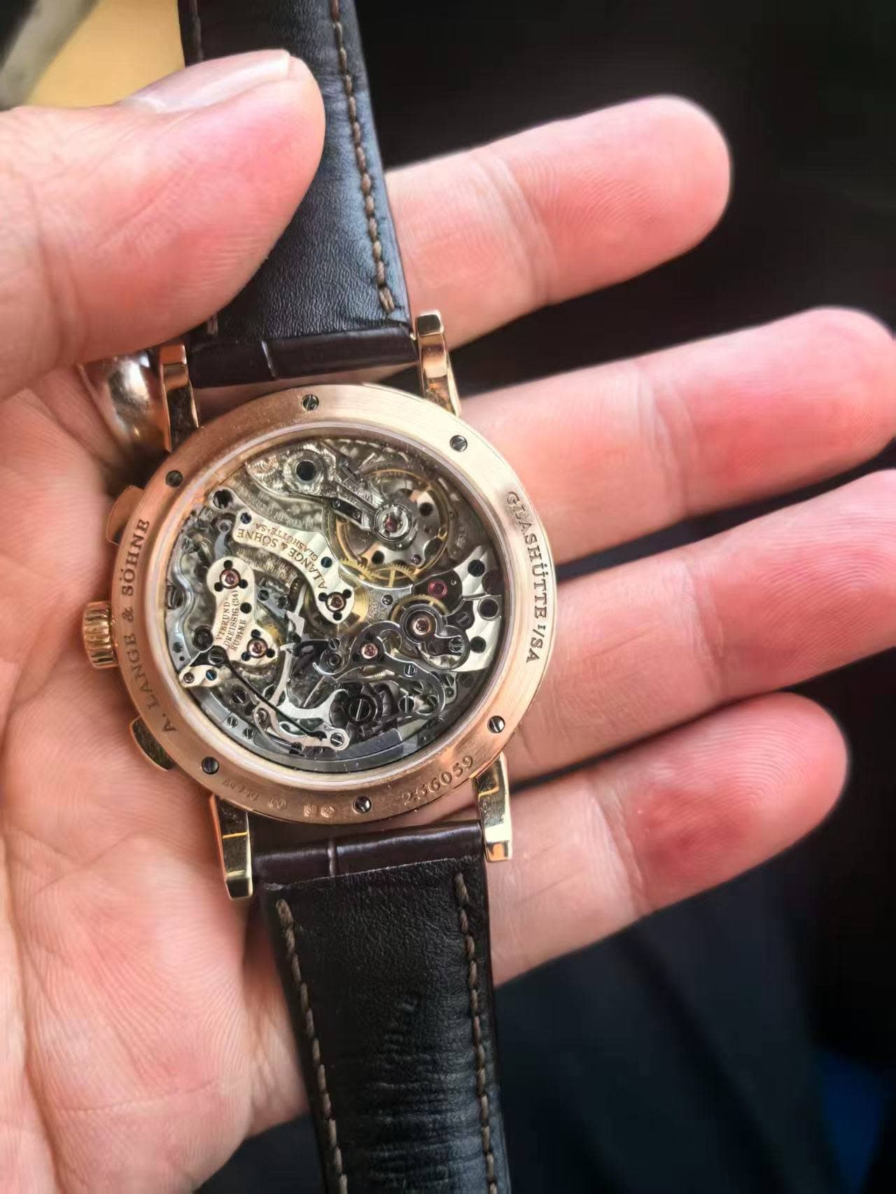 May be an image of wrist watch and text that says '南 -국한 TNHOS SOHNE LANGE GIASHUTTE τε ท /SA จ'