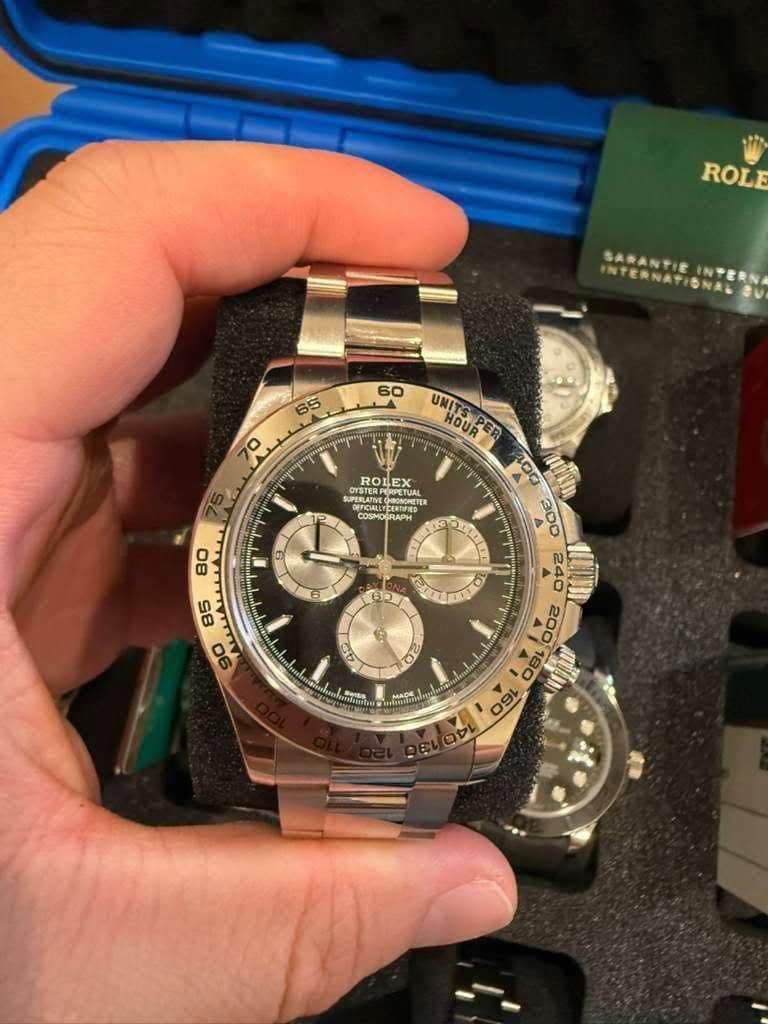 May be an image of wrist watch and text
