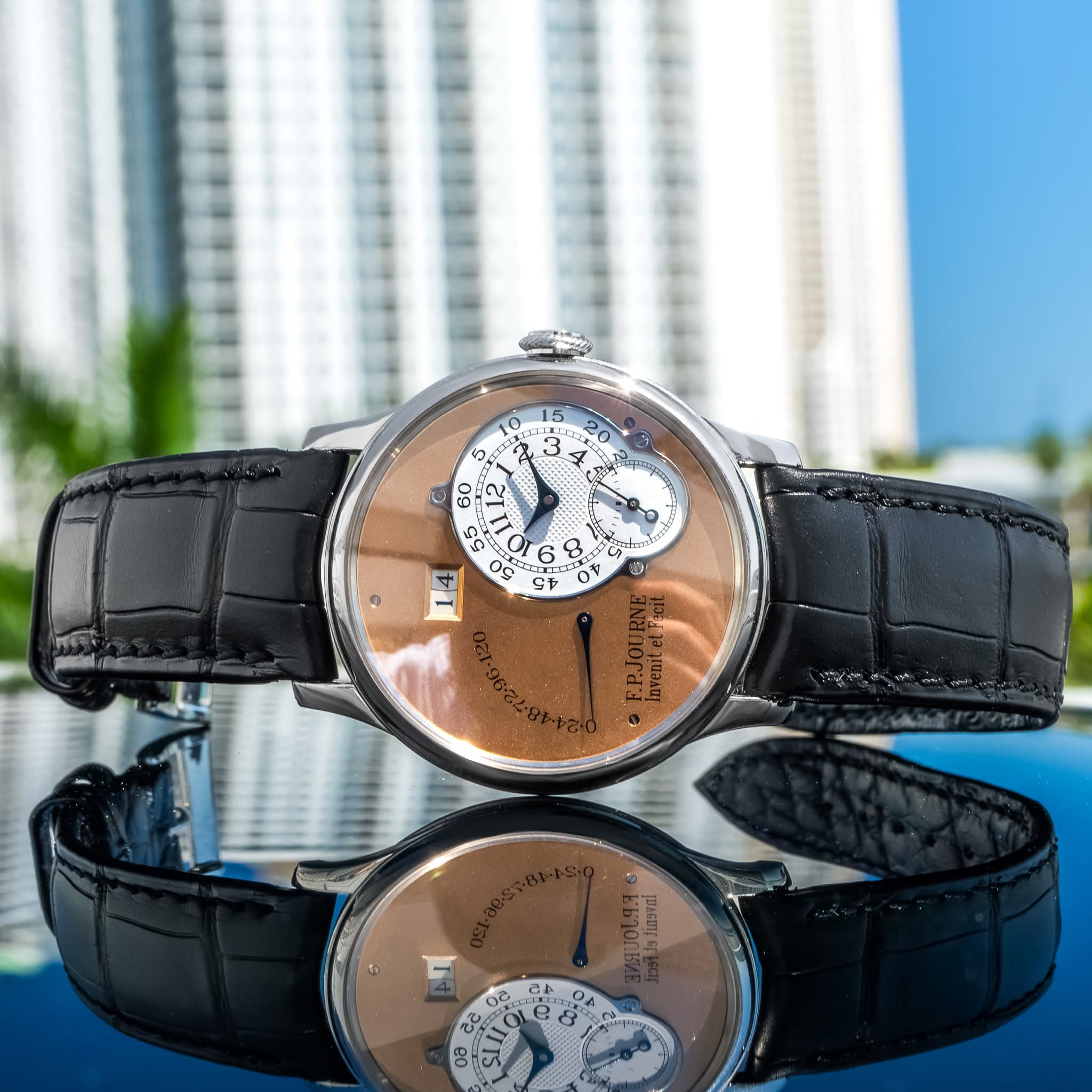 May be an image of wrist watch and text