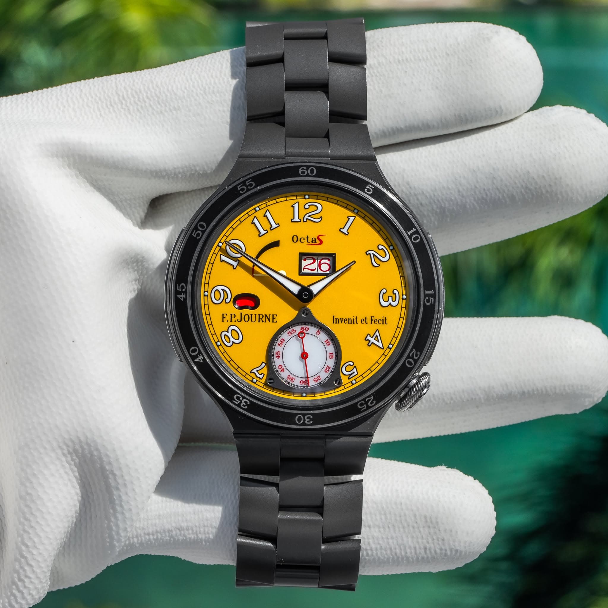 May be an image of digital watch and text that says '11 Octas 12 1 ב 26 ത F.P.JOURNE 00 ω Invenit tet Fecil A หน'