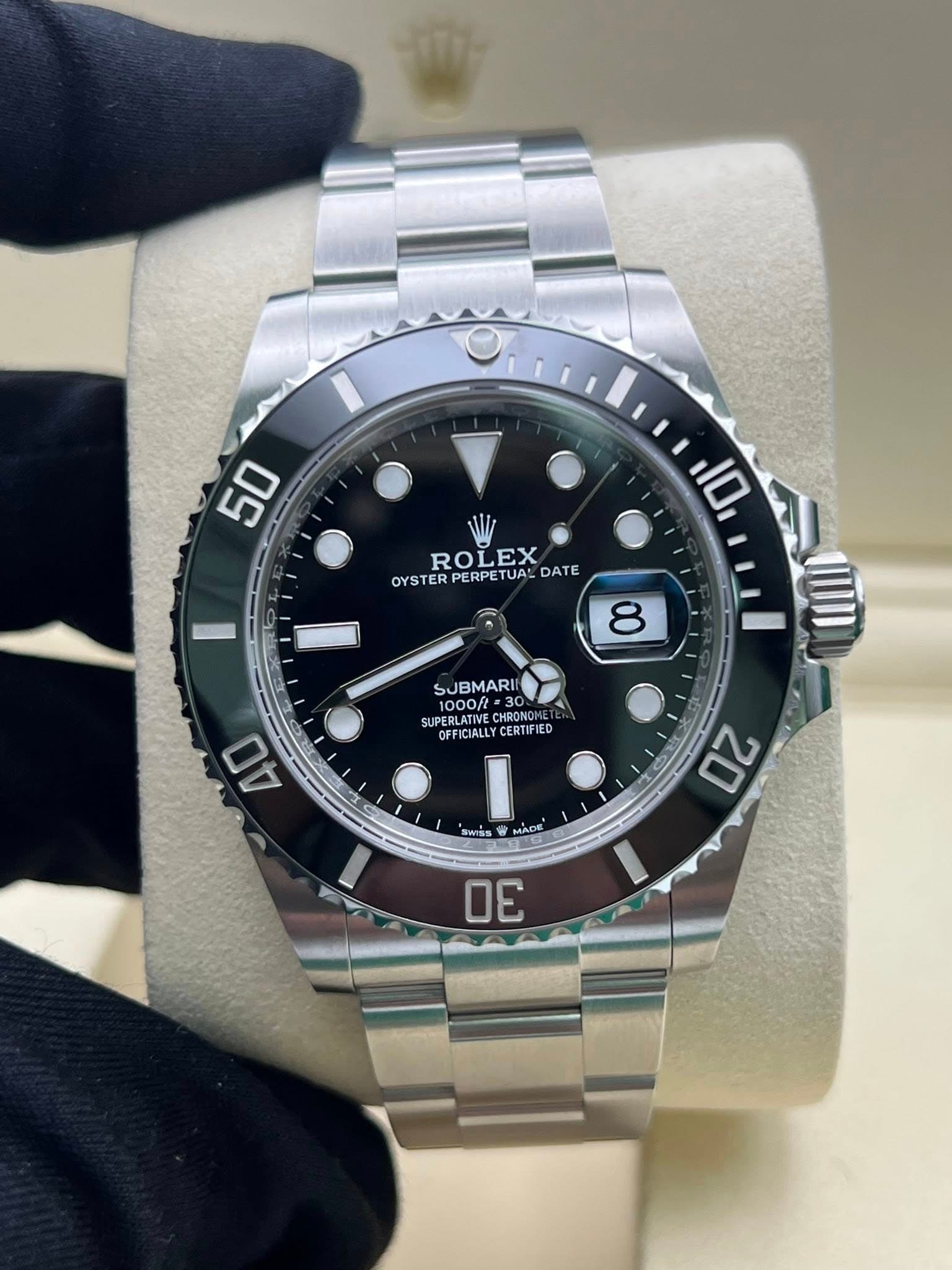May be an image of wrist watch and text that says '50 ROLEX OYSTER STERPERPETUALDAT PERPETUAL DATE 10 8 لی SUBMARII 1000/t SUPERLATIVE AENLATIVE CHRONO OFFICIALLY…