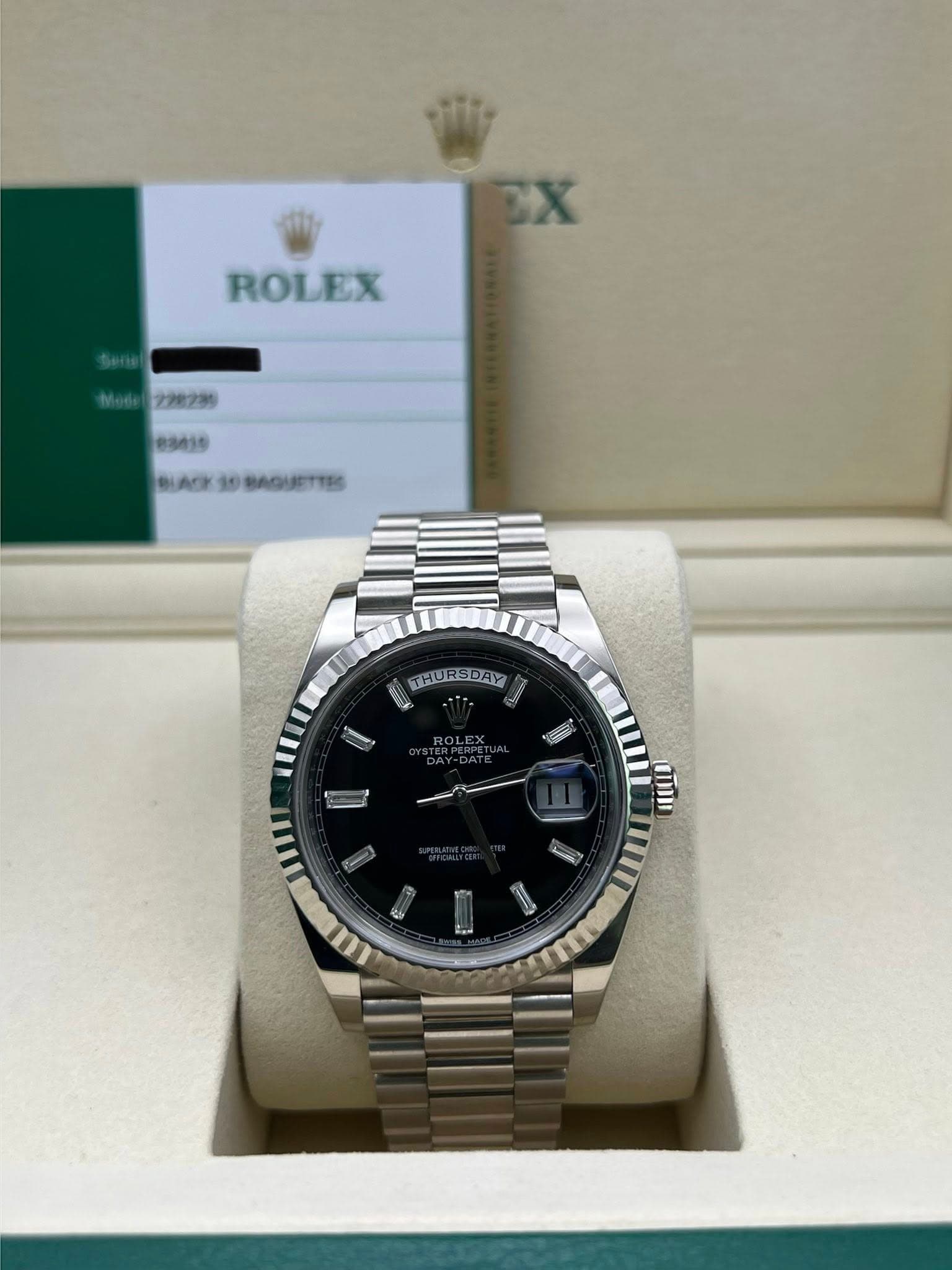 May be an image of wrist watch and text