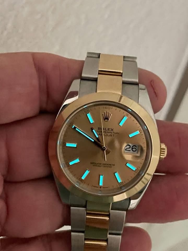 May be an image of wrist watch and text