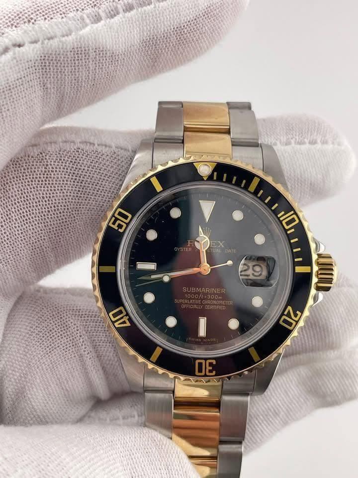May be an image of wrist watch and text that says 'ga 50 RDEX Tuau DATE EX 29 RINER 10 mU 20 40 ه'