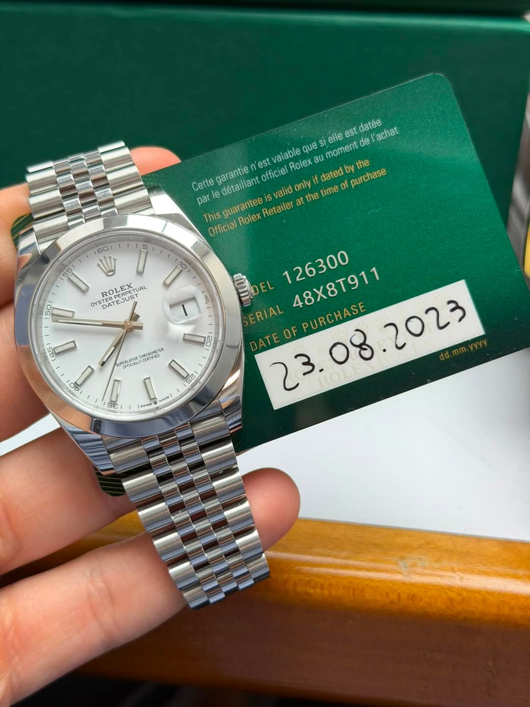 May be an image of wrist watch and text that says 'est datee achat alable Rolex dated the ques moment de Cette détaillant Svalid only y garantie nest officiel purchase par at…