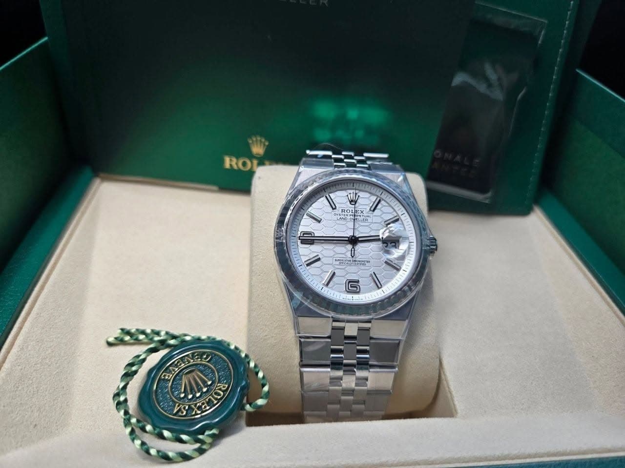 May be an image of wrist watch and text