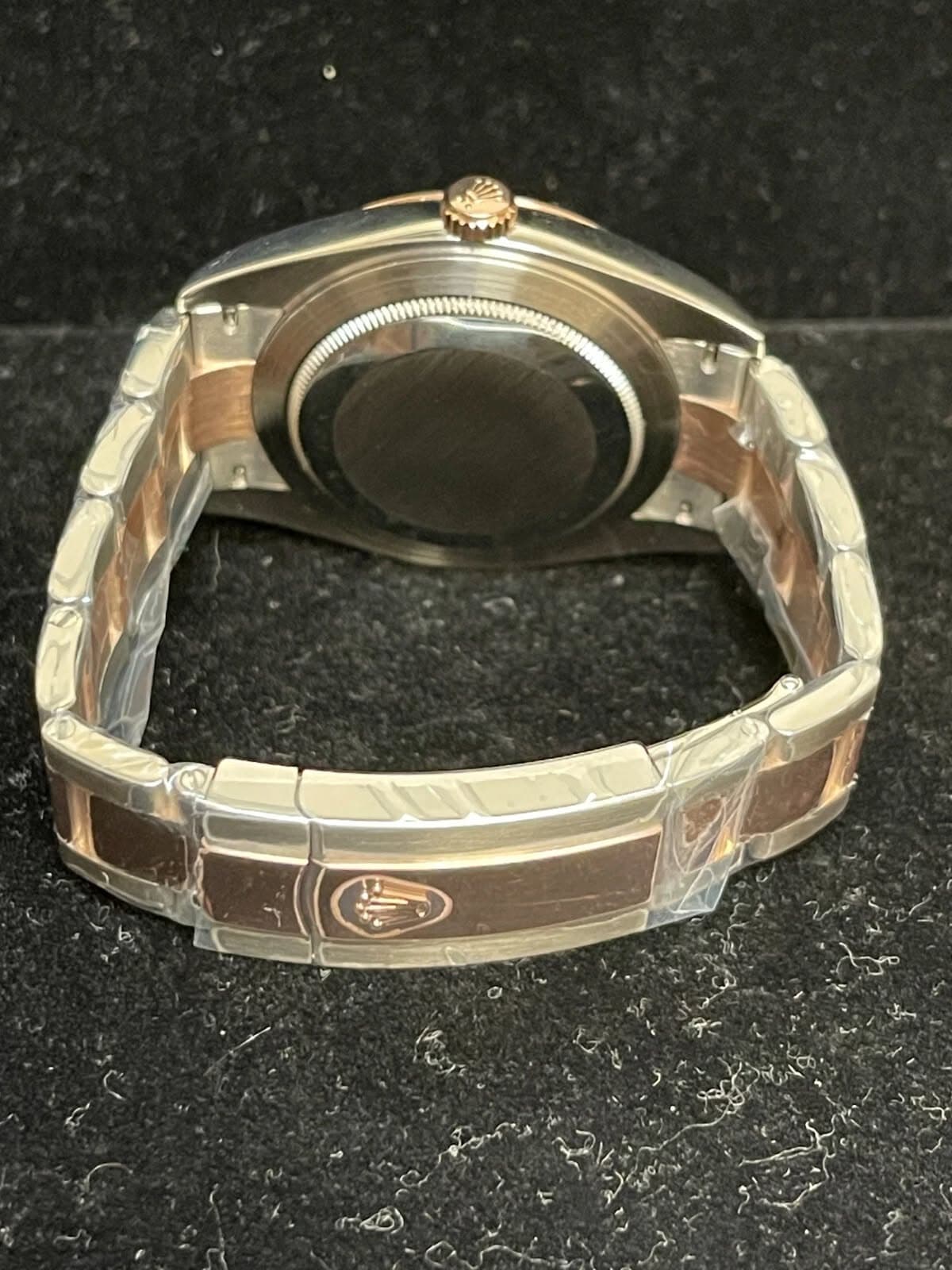 May be an image of wrist watch and text